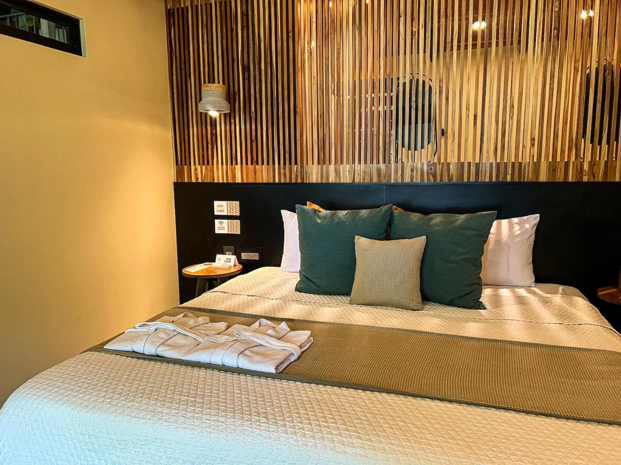 Bed in awā Beachfront Hotel