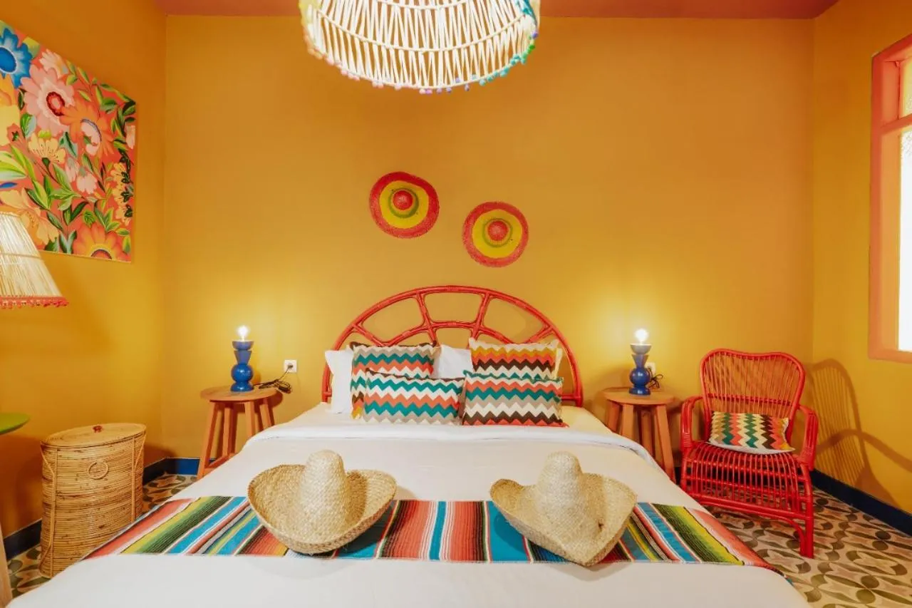 Bed in Por Aqui Stay & Dine