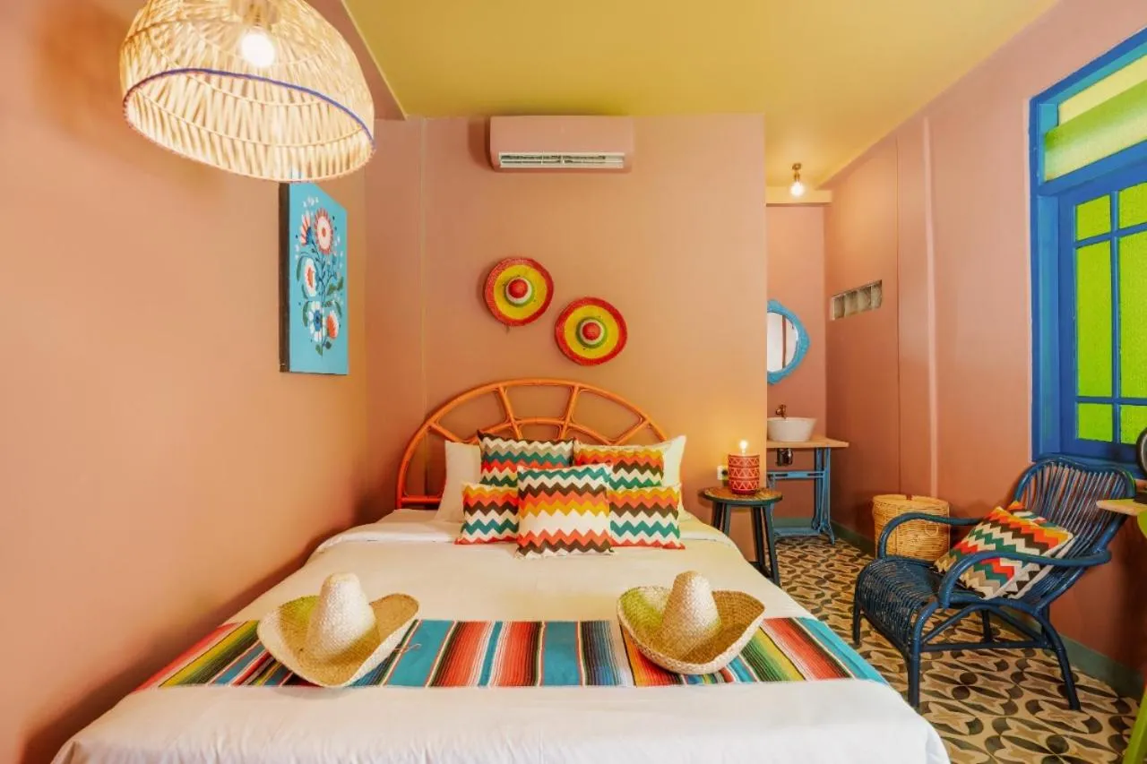 Bed in Por Aqui Stay & Dine