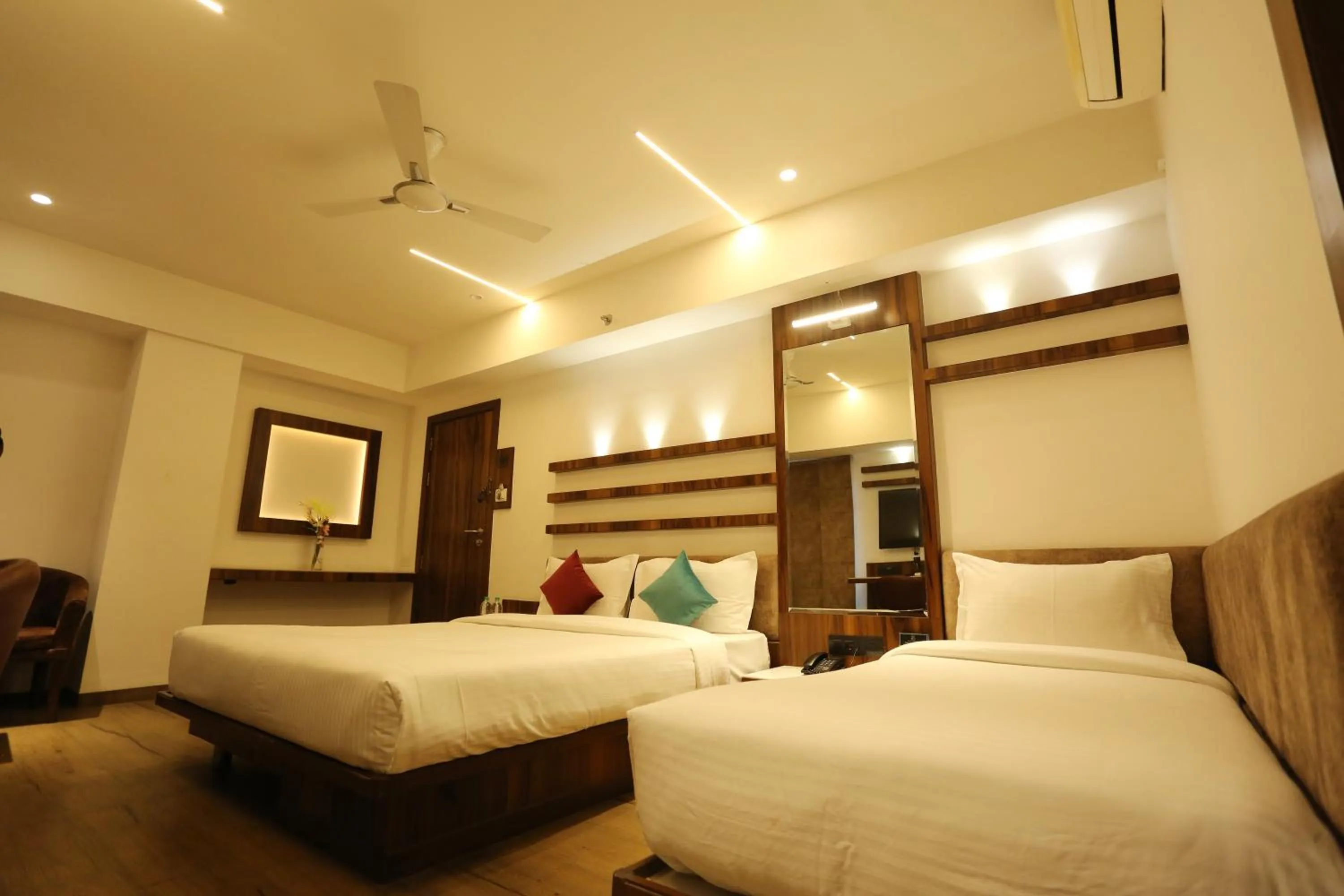 Photo of the whole room, Bed in Pravasa hotel Indore