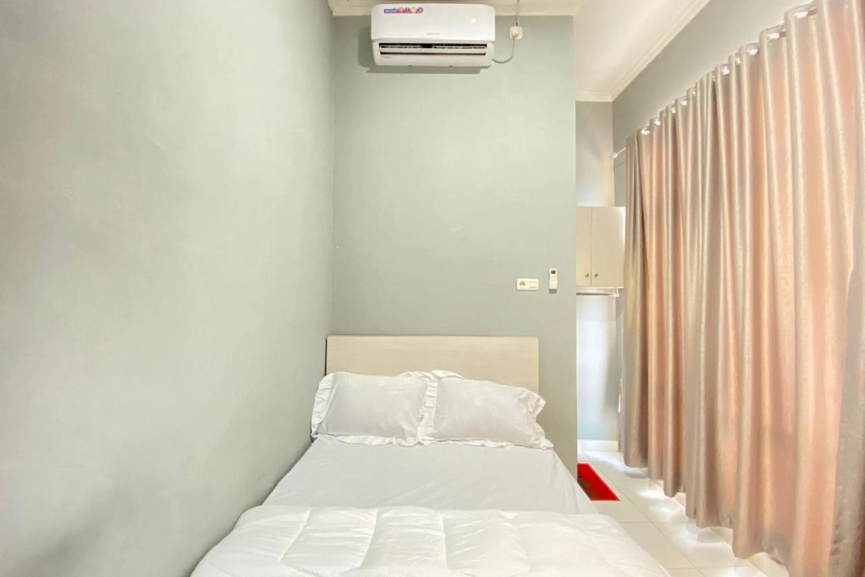 Bed in Pelangi Guest House Palembang RedPartner