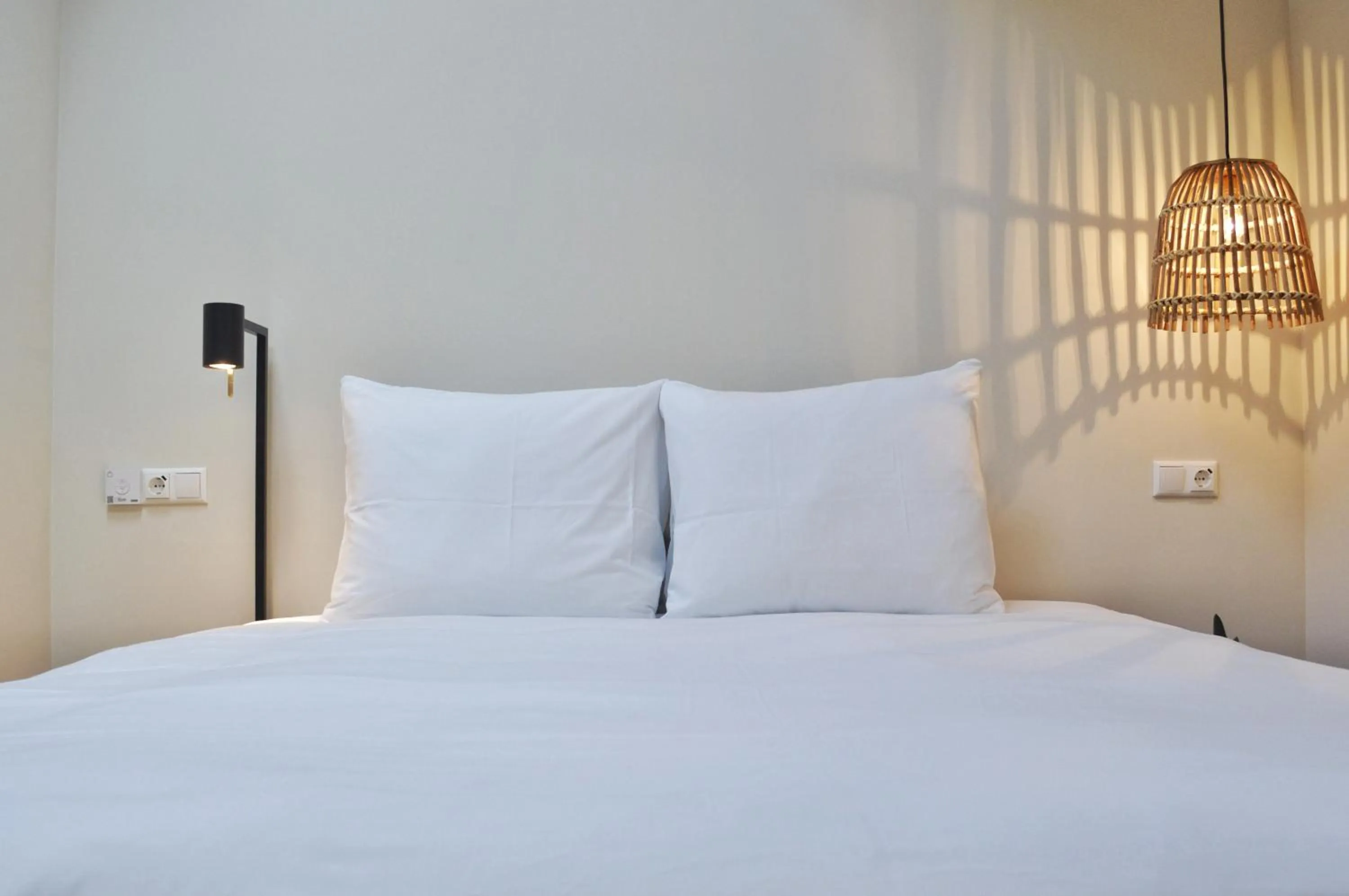 Bed in Van Heeckeren Apartments & Suites Buren