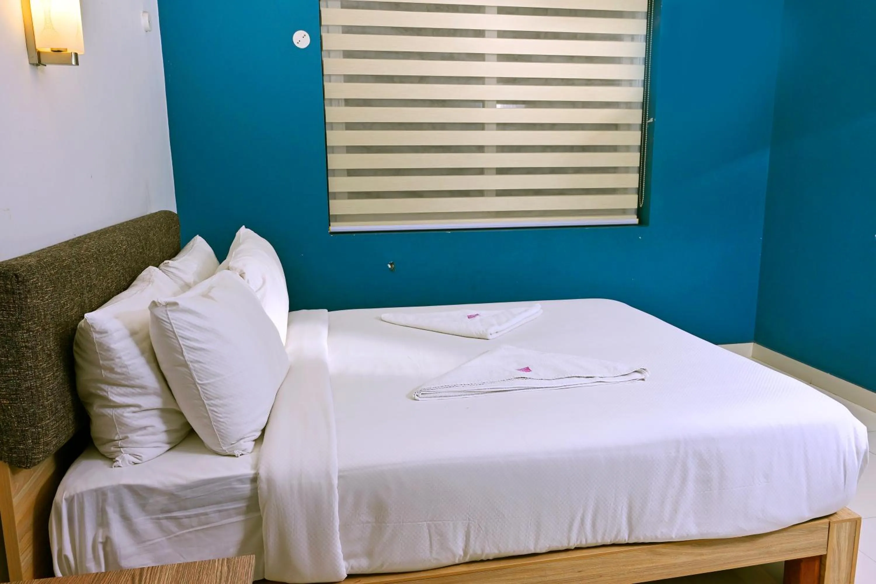 Photo of the whole room, Bed in Transit Suites by GrandWest