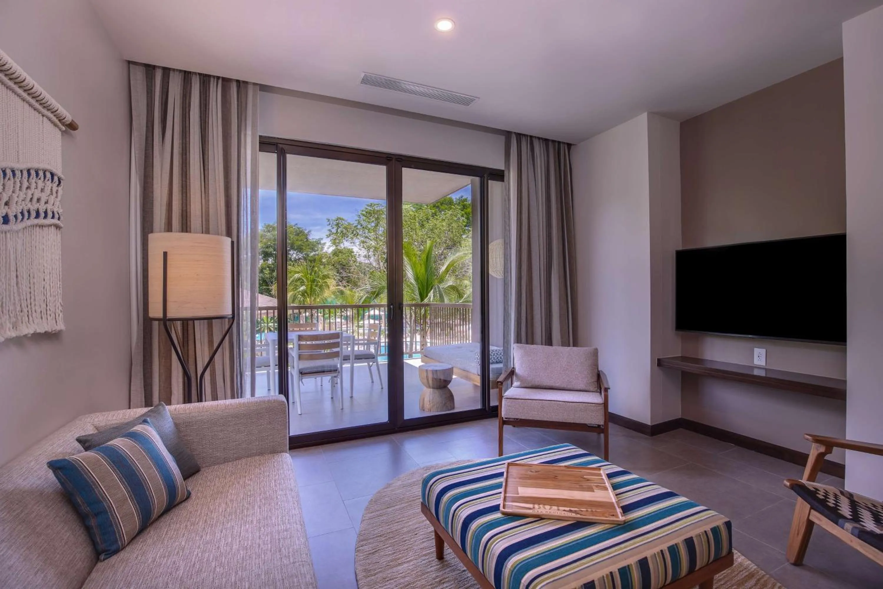 Living room, Bed in Botanika Osa Peninsula, Curio Collection By Hilton