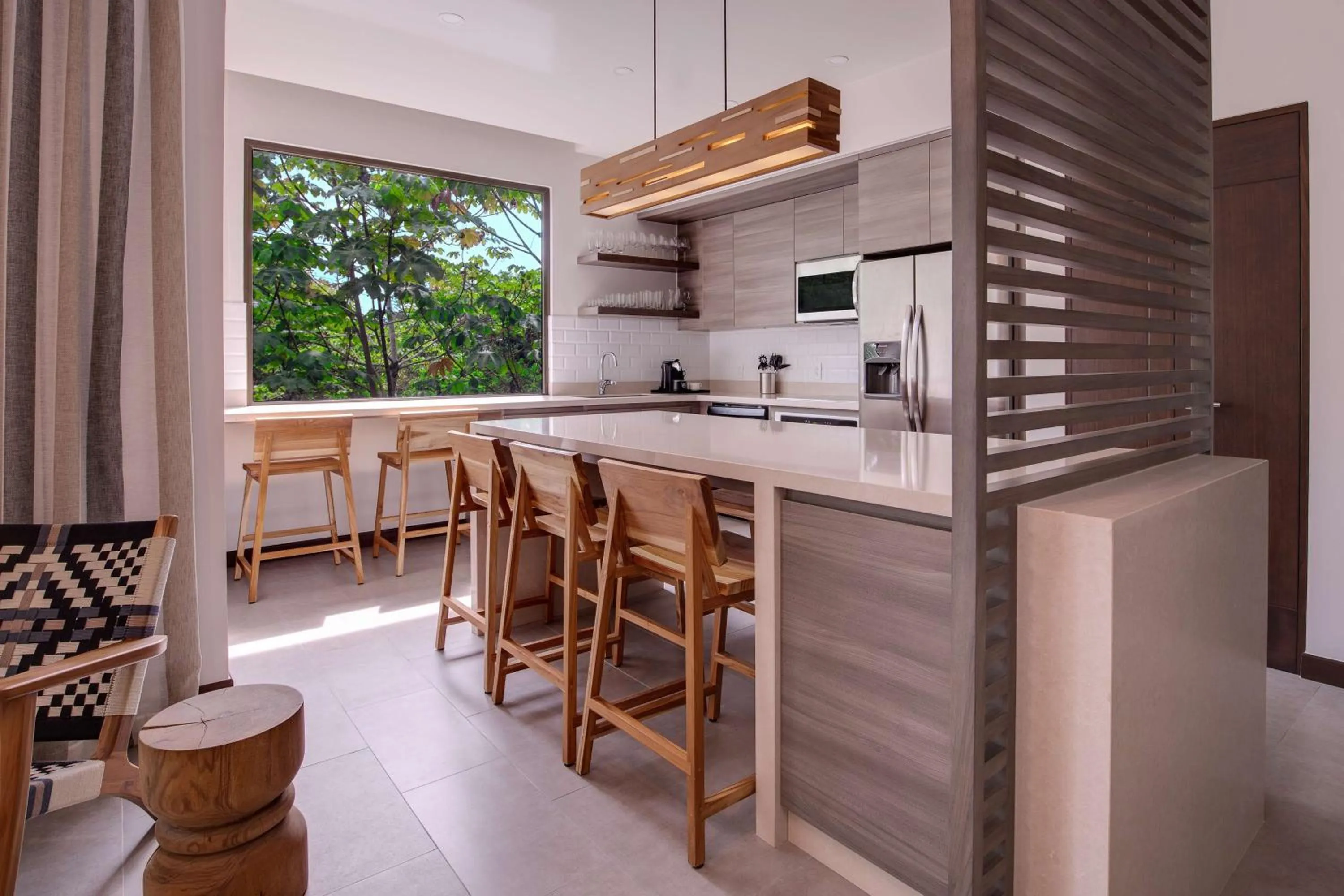 Kitchen or kitchenette in Botanika Osa Peninsula, Curio Collection By Hilton