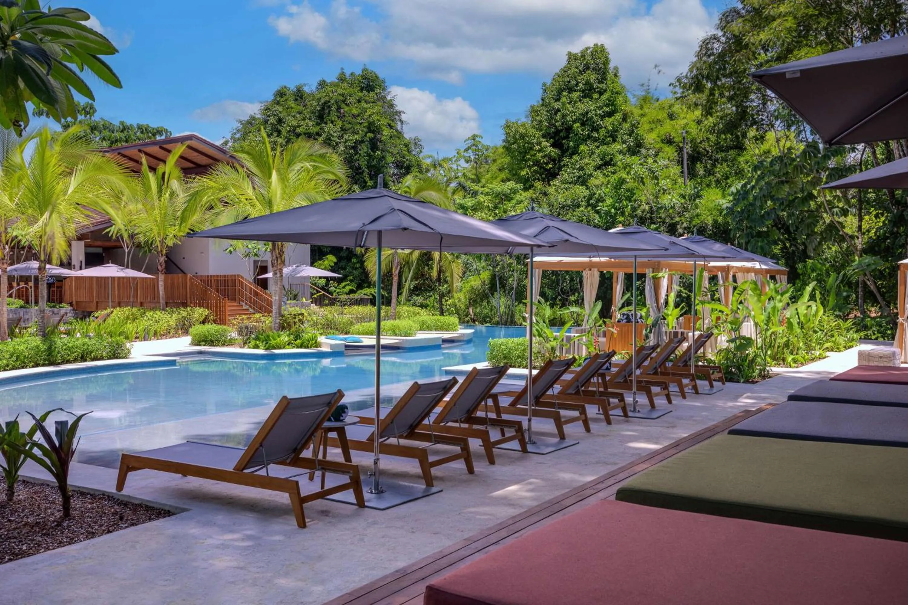 Pool view in Botanika Osa Peninsula, Curio Collection By Hilton