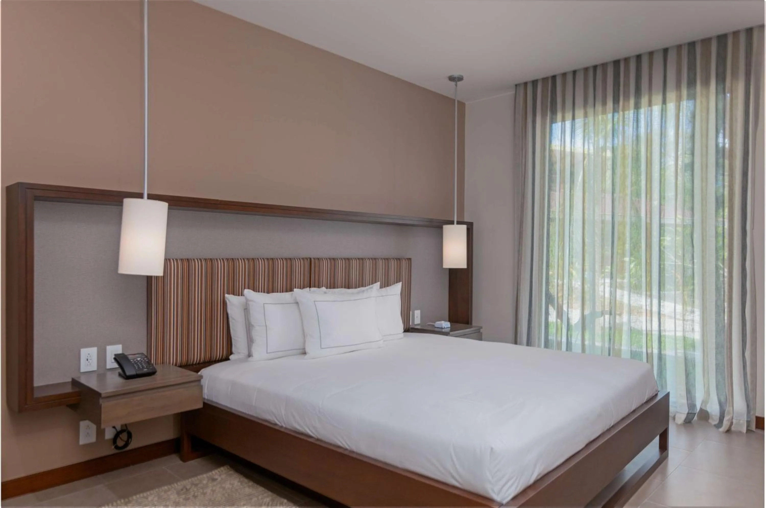 Bed in Botanika Osa Peninsula, Curio Collection By Hilton