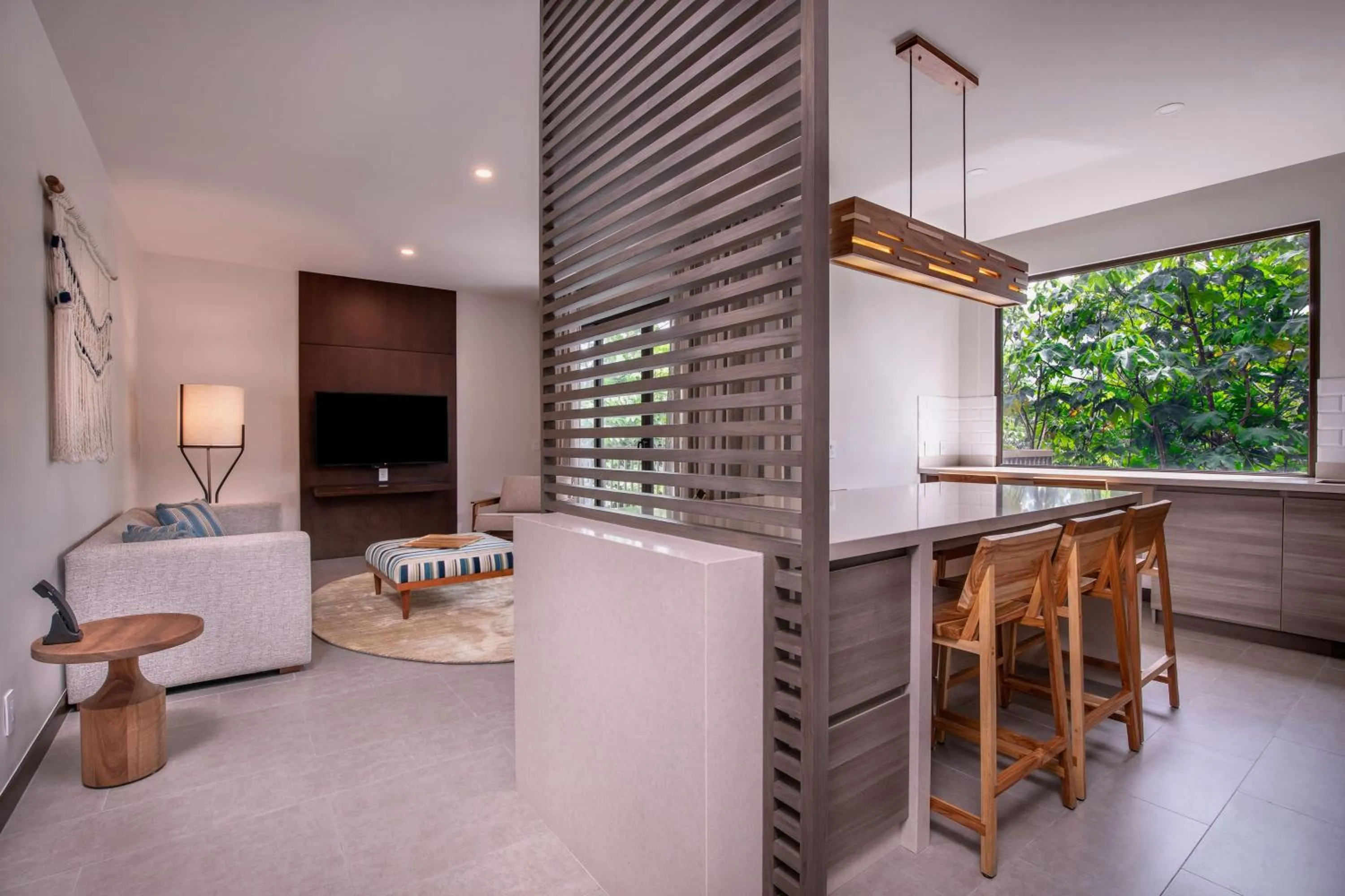 Living room in Botanika Osa Peninsula, Curio Collection By Hilton