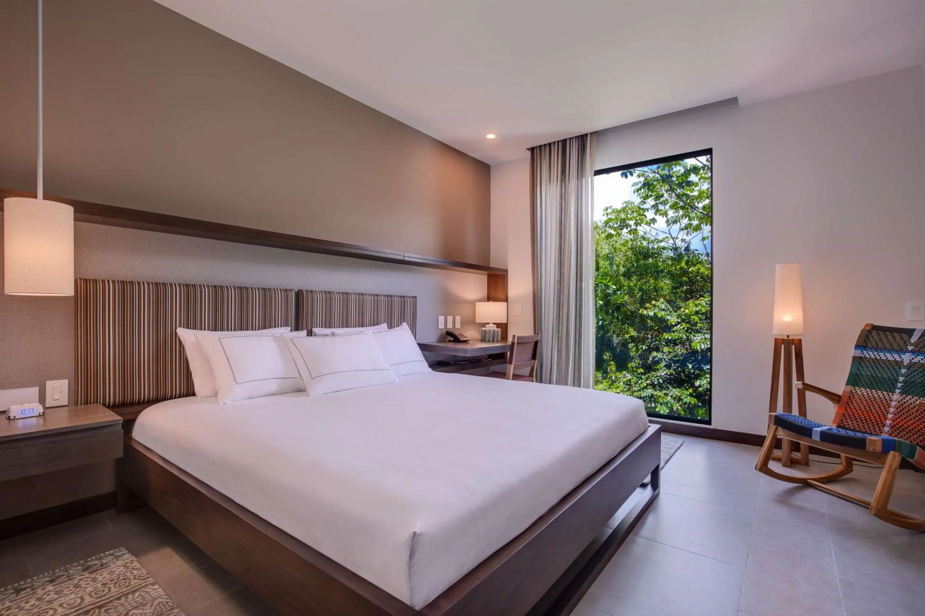 Bed in Botanika Osa Peninsula, Curio Collection By Hilton