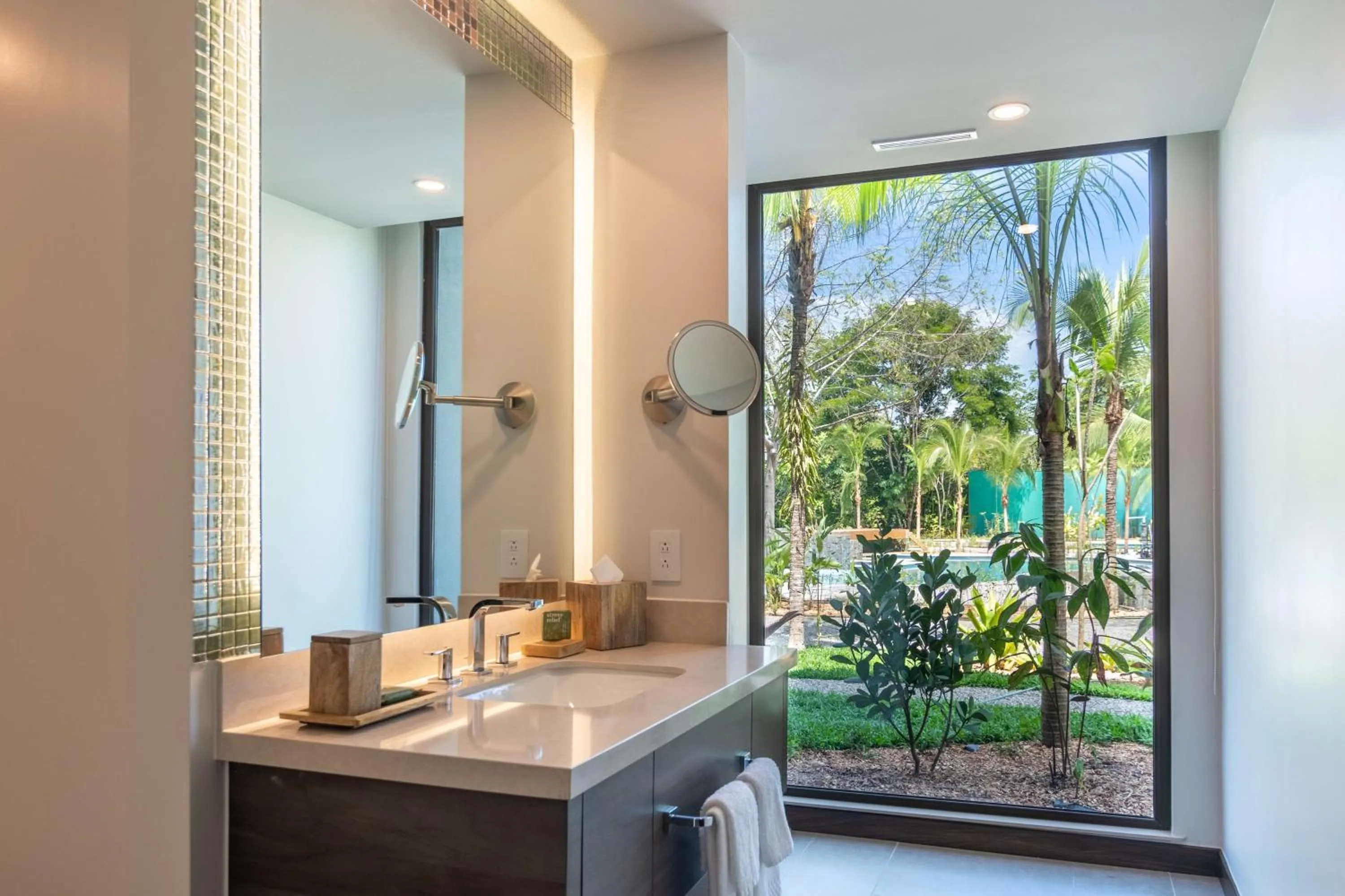 Bathroom in Botanika Osa Peninsula, Curio Collection By Hilton