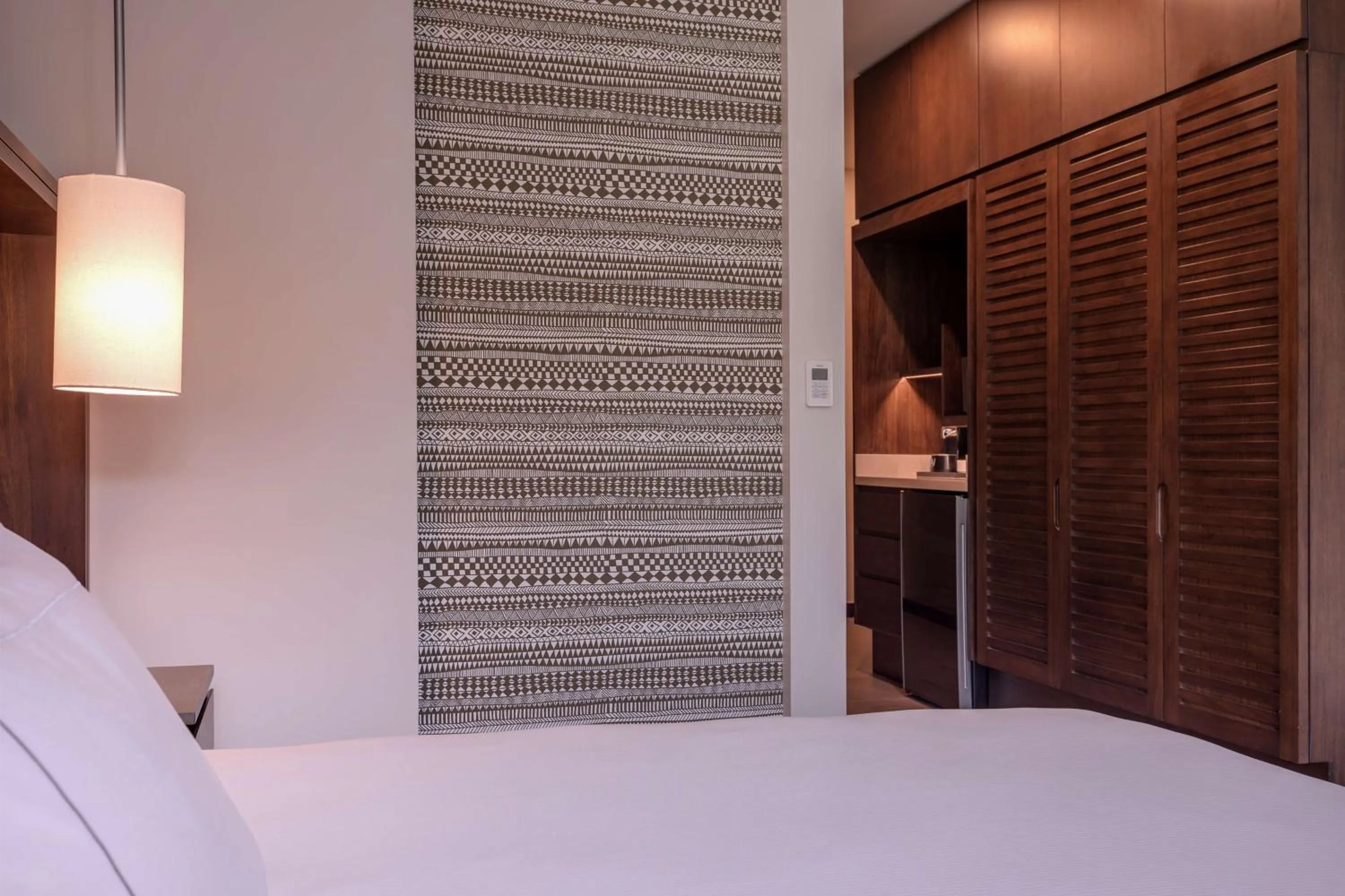 Bed in Botanika Osa Peninsula, Curio Collection By Hilton