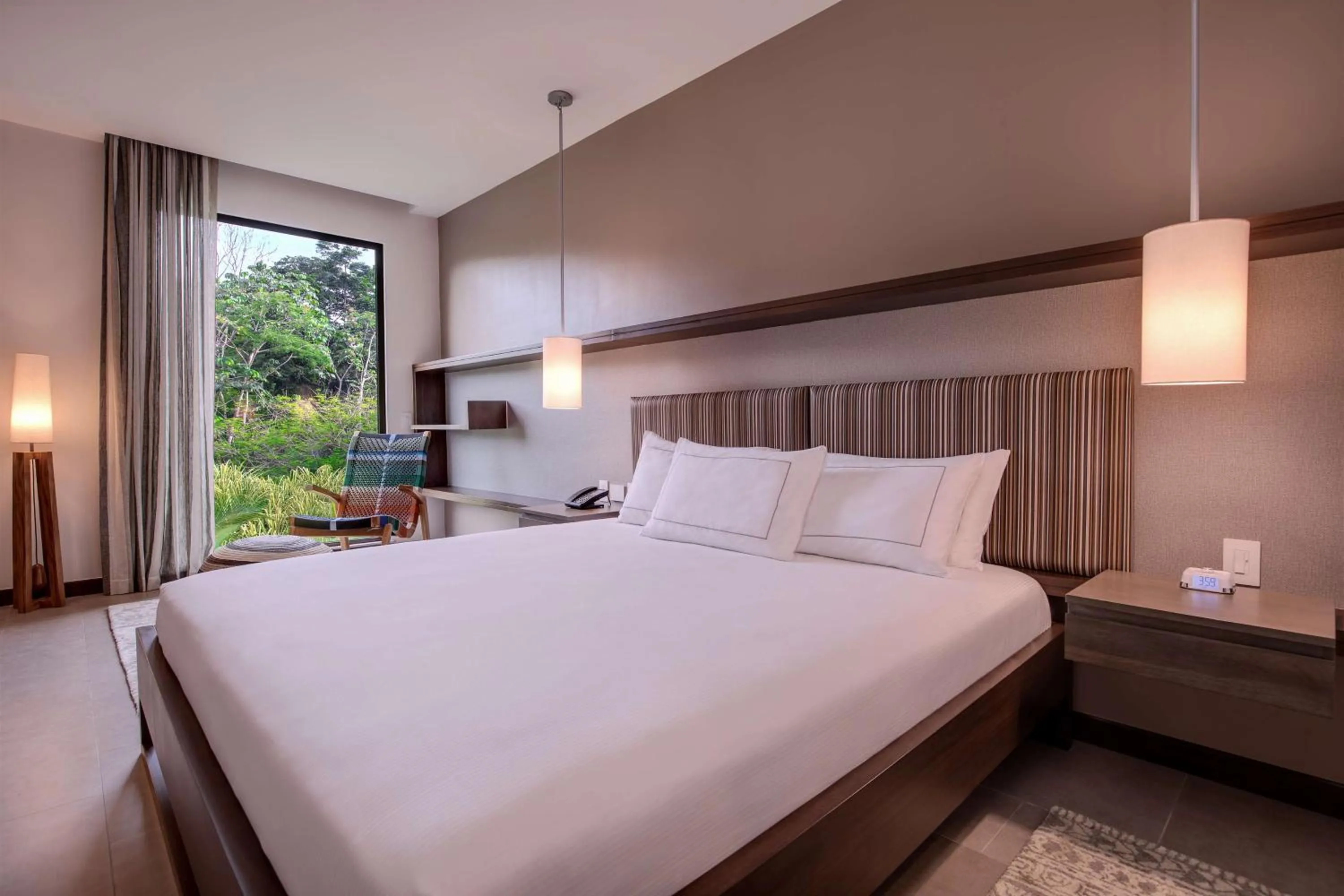 Bed in Botanika Osa Peninsula, Curio Collection By Hilton