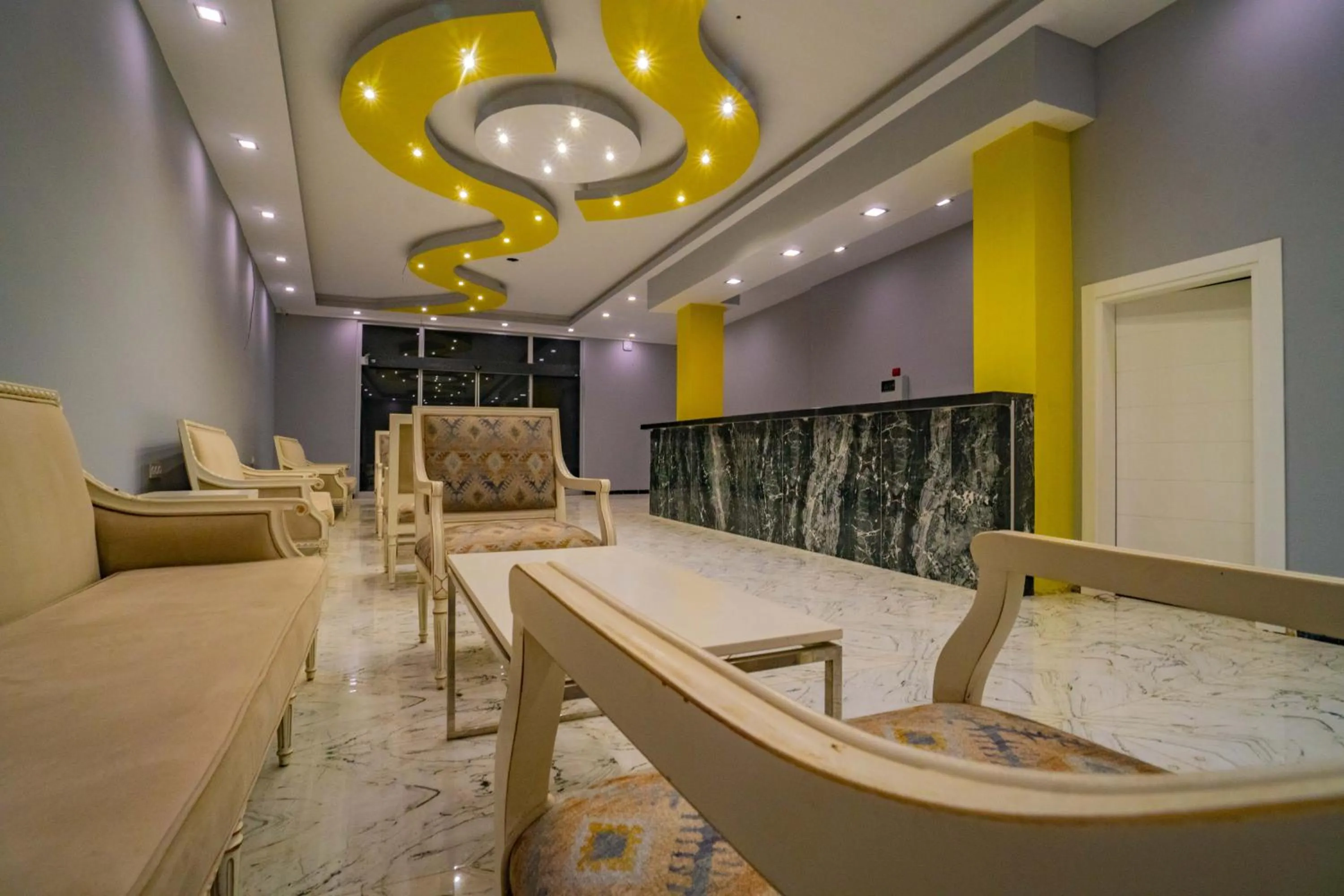 Communal lounge/ TV room in Prenses Sealine Beach Hotel