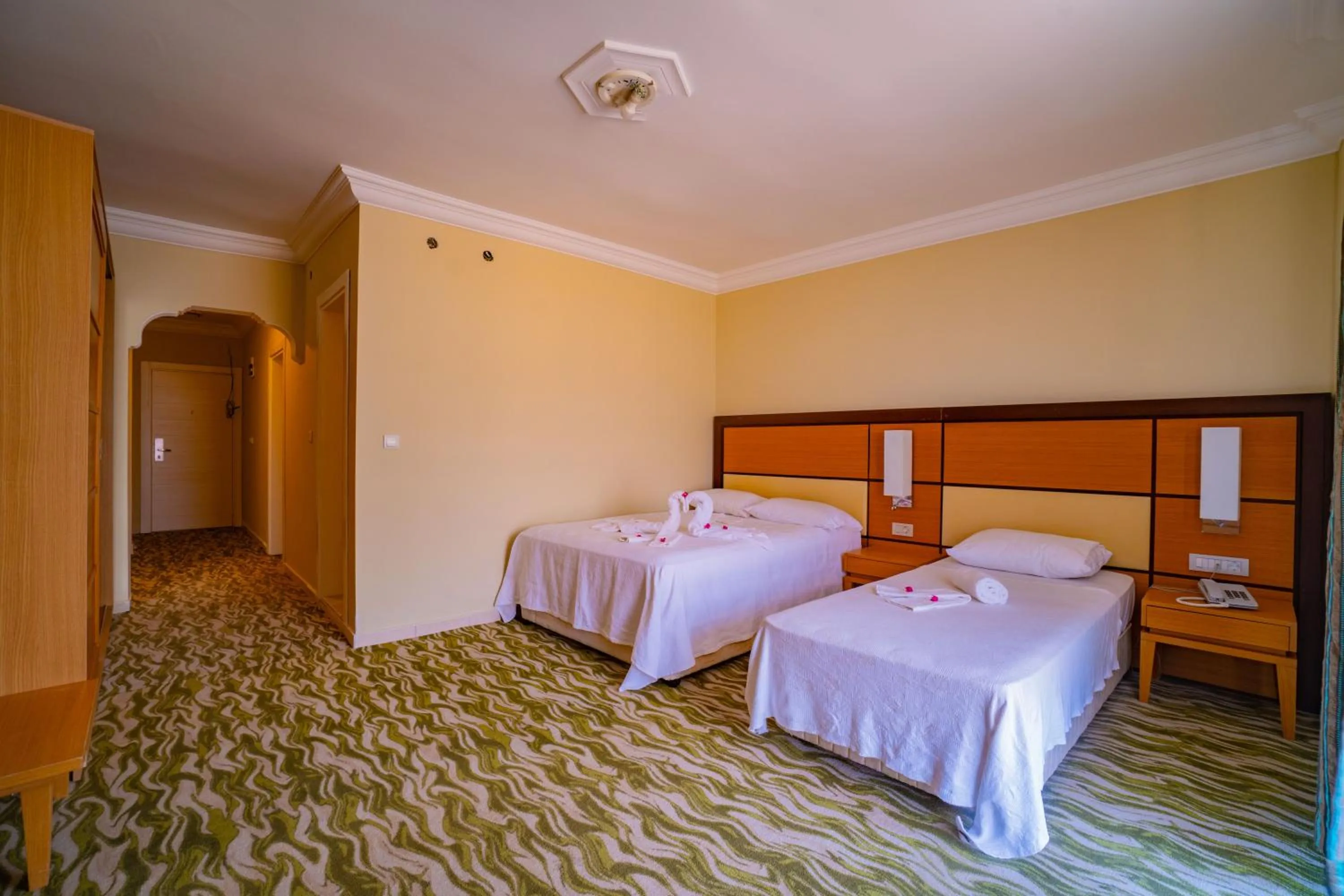 Bed in Prenses Sealine Beach Hotel