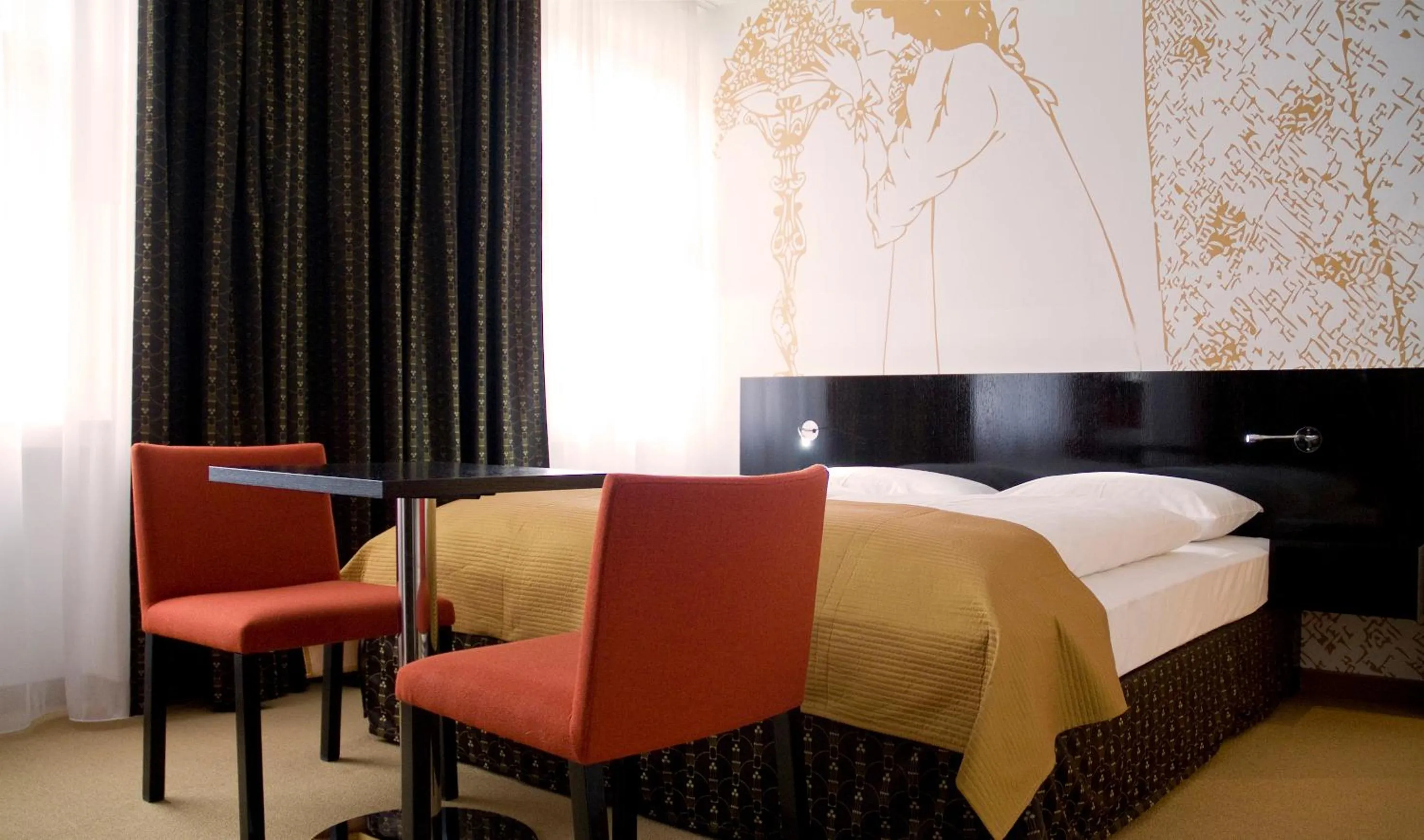 Living room, Bed in Alma Boutique-Hotel