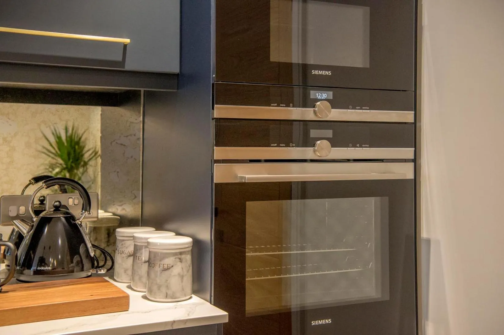 Kitchen or kitchenette in The Quadrant - The Botanical Suite