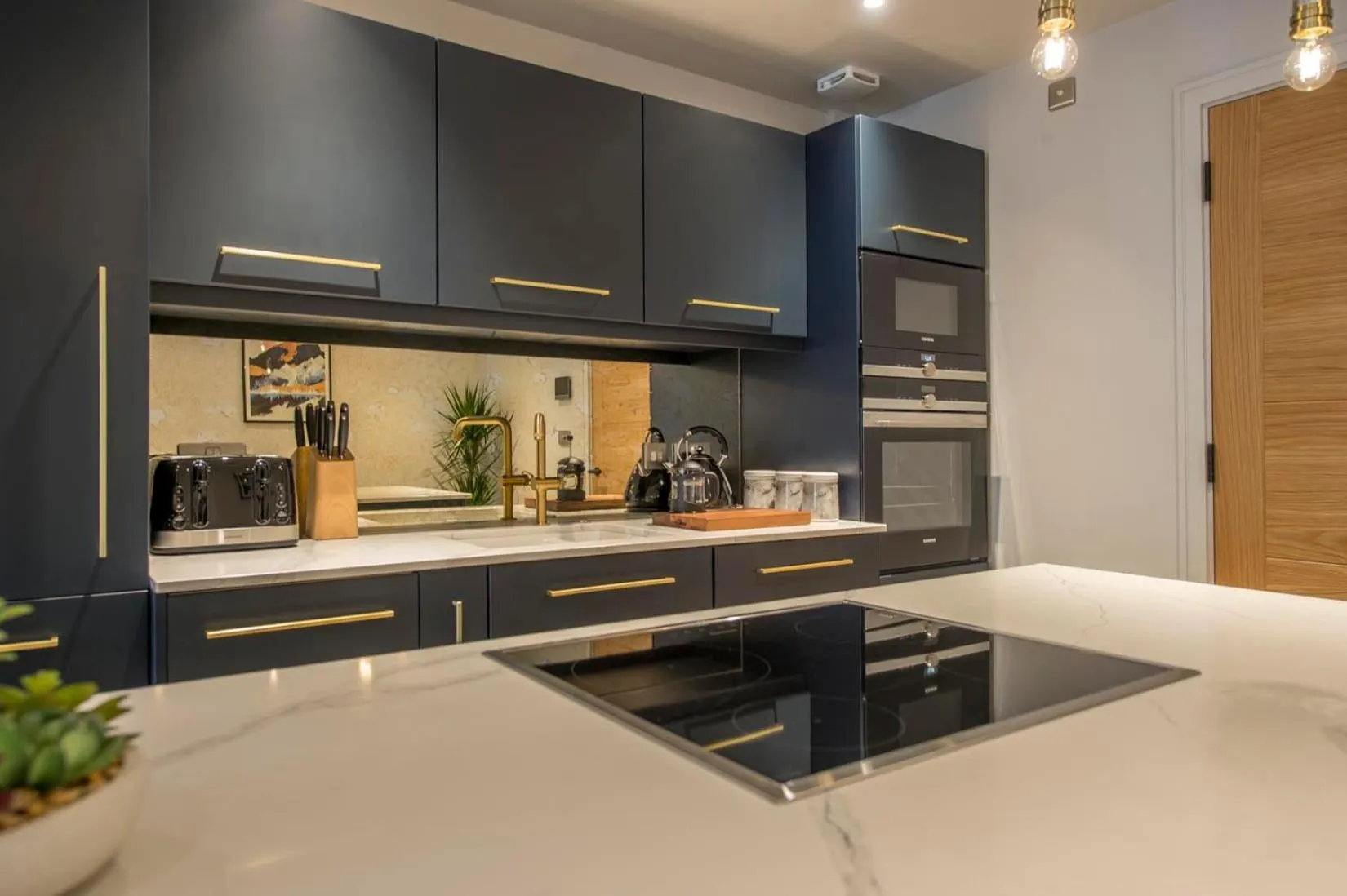 Kitchen or kitchenette in The Quadrant - The Botanical Suite