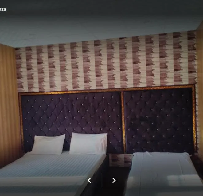 Bed in Arcadian Inn Hotel