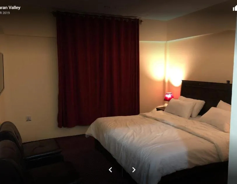 Bed in Arcadian Inn Hotel