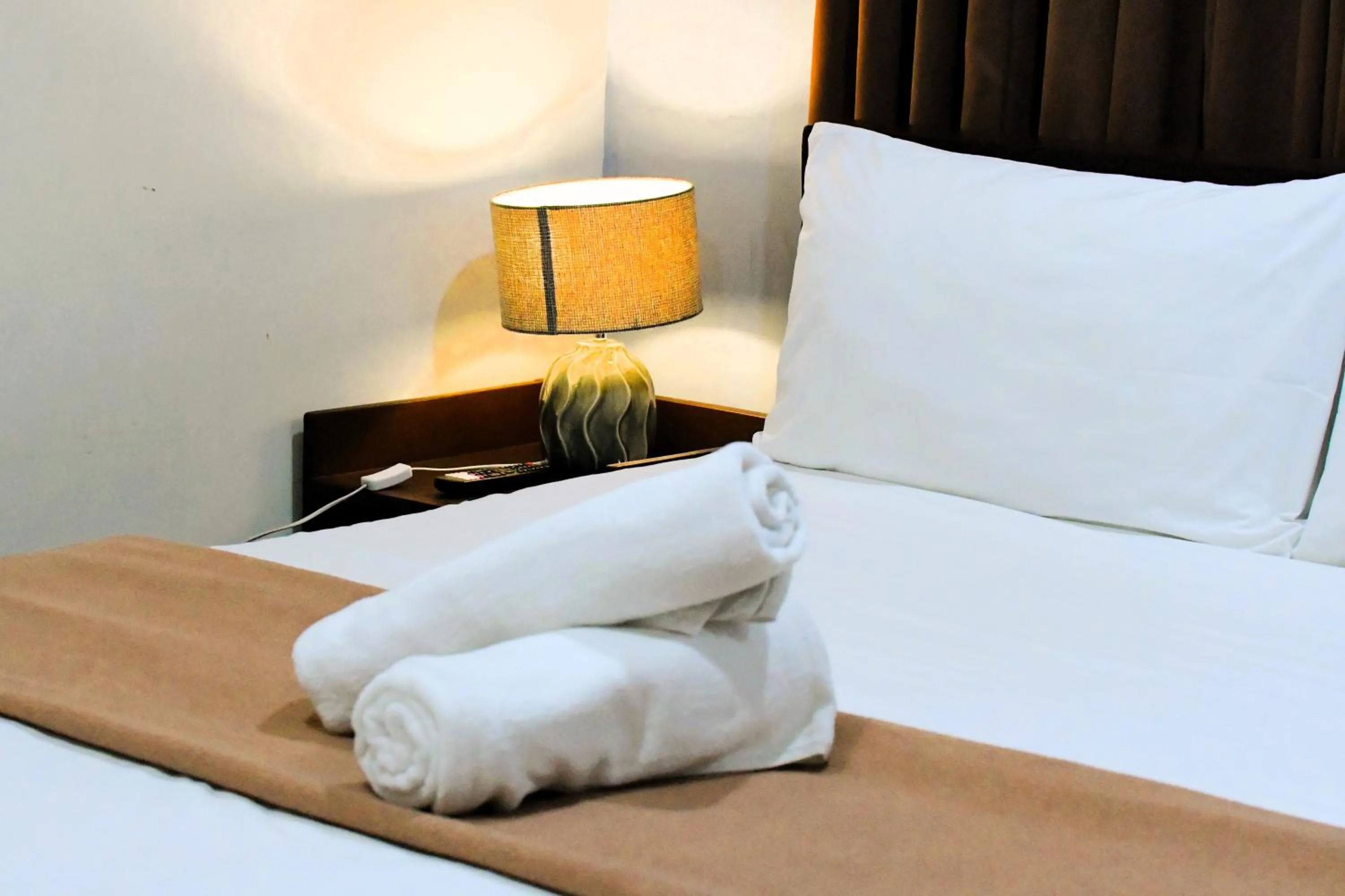 Bed in Arzo Hotel Makati