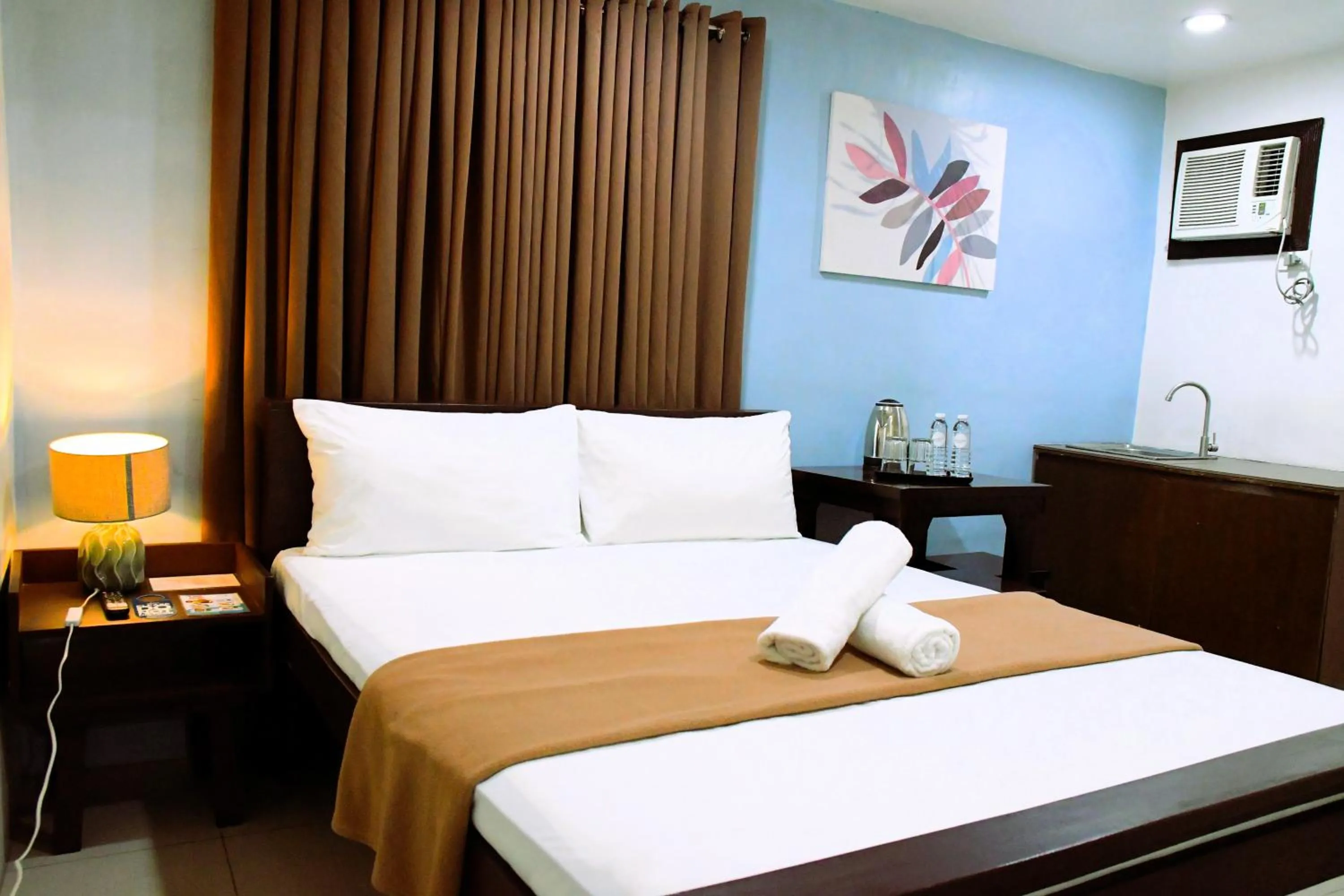Bed in Arzo Hotel Makati