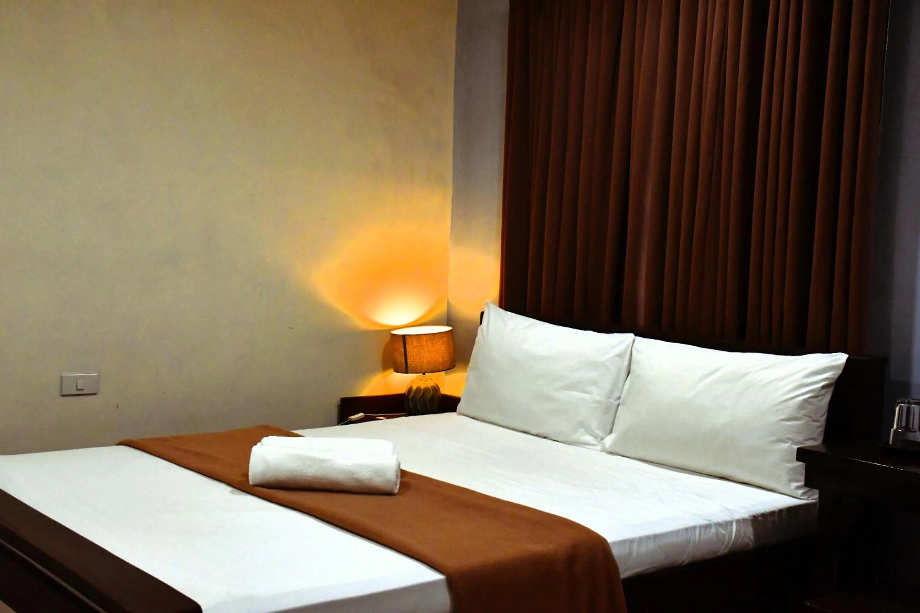 Bed in Arzo Hotel Makati
