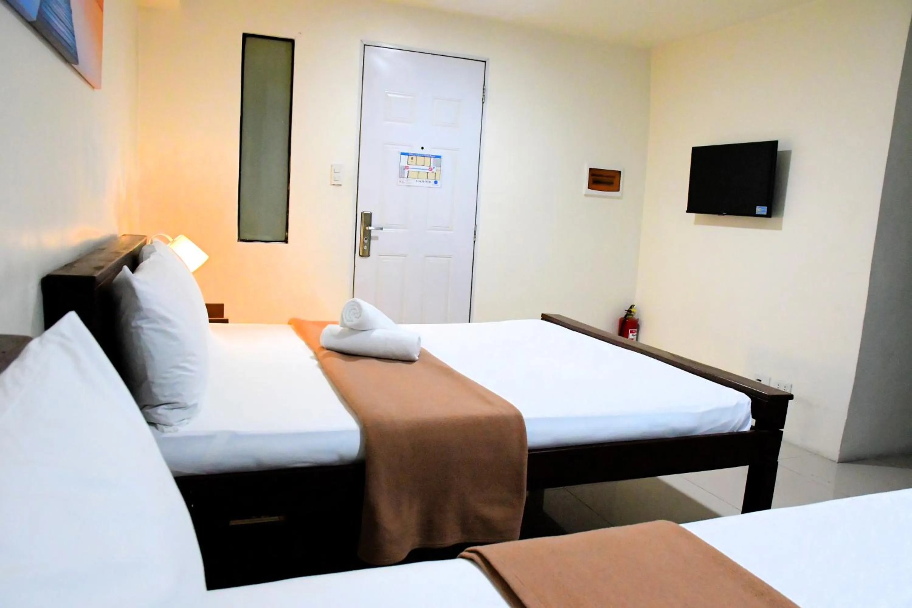 Bed in Arzo Hotel Makati