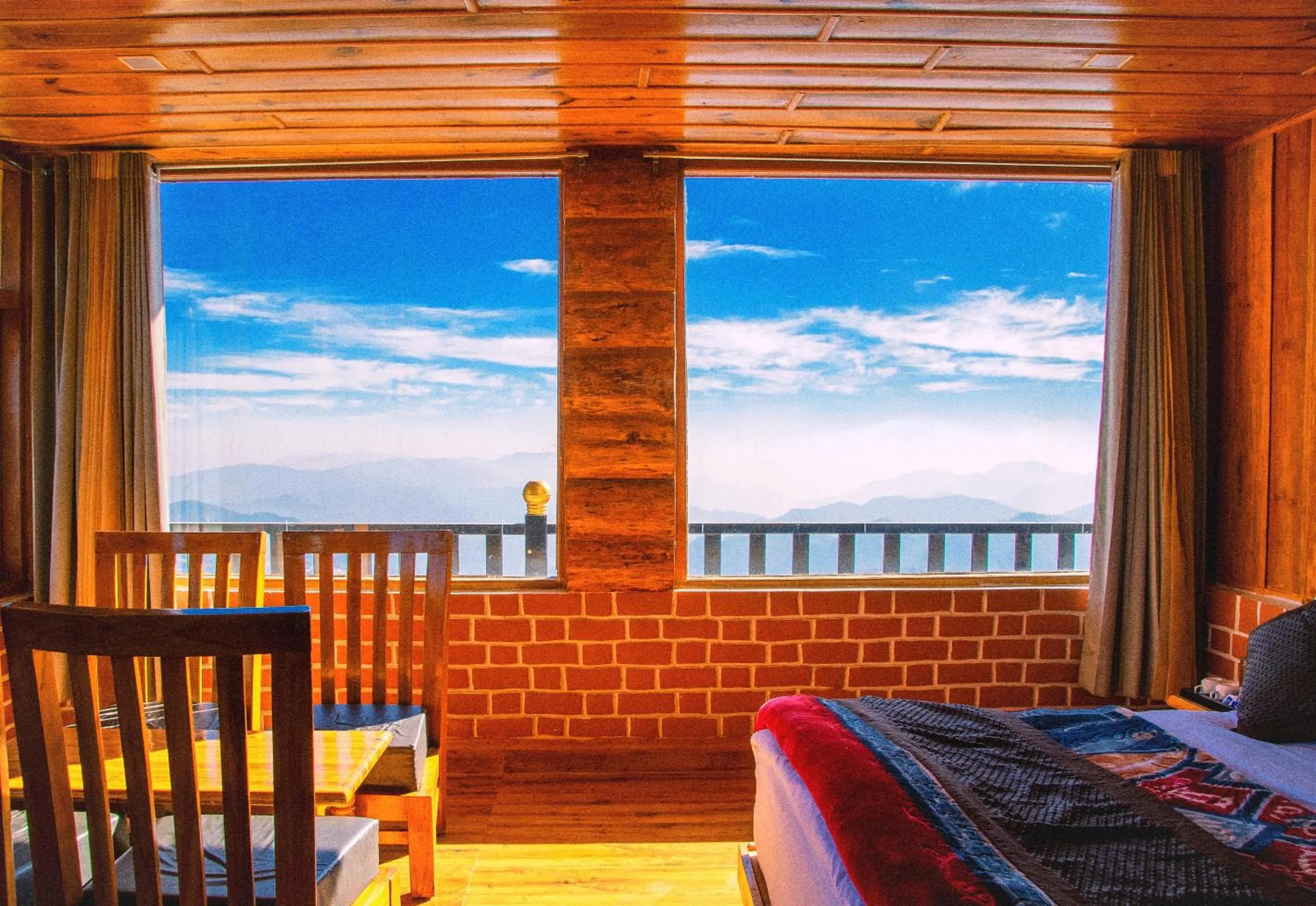 Photo of the whole room in LA Riqueza Kanatal - Mountain View Rooms - Best Location - Amazing Food - Close to Jungle Safari & Adventure Activities