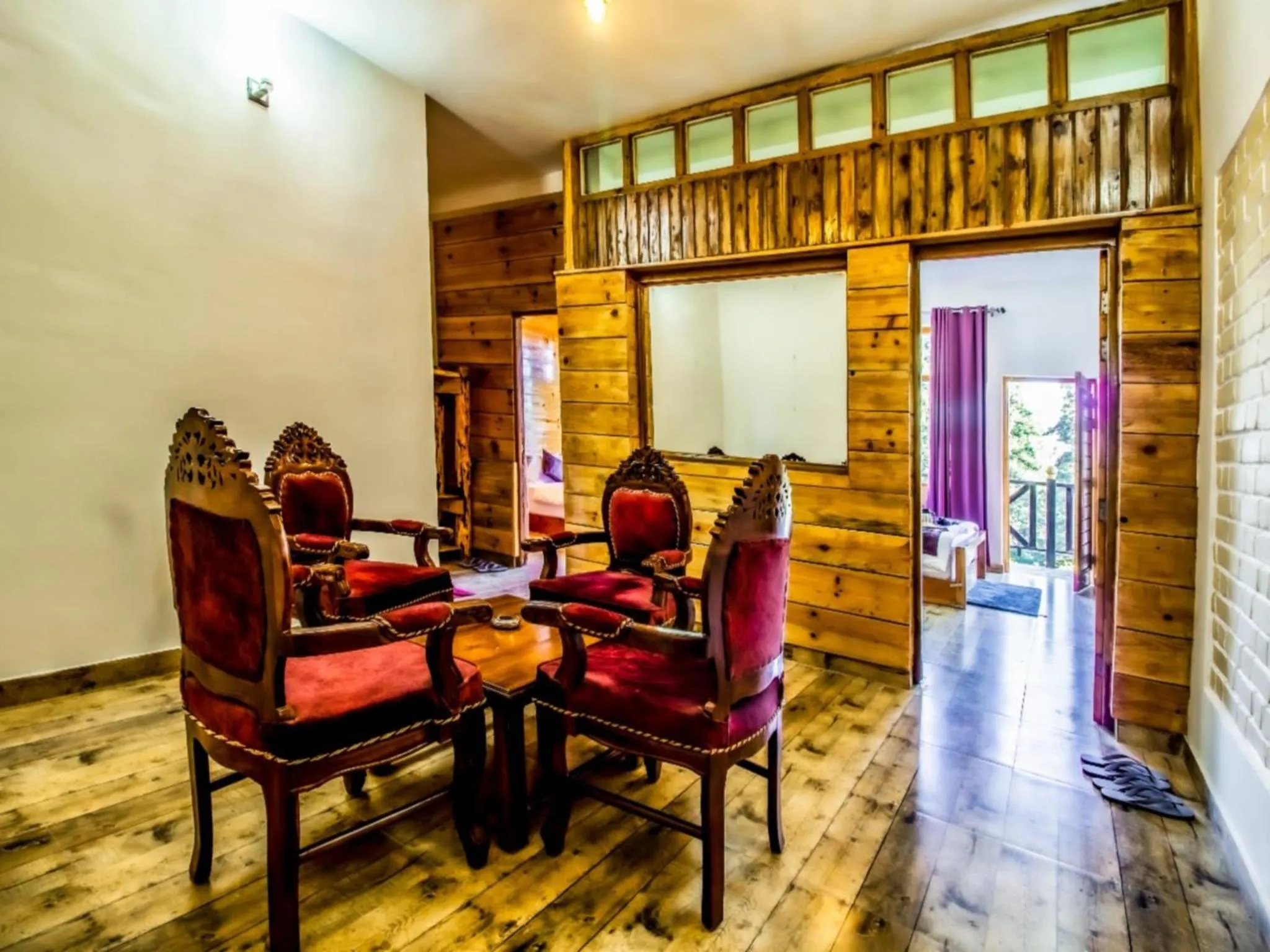 Living room in LA Riqueza Kanatal - Mountain View Rooms - Best Location - Amazing Food - Close to Jungle Safari & Adventure Activities