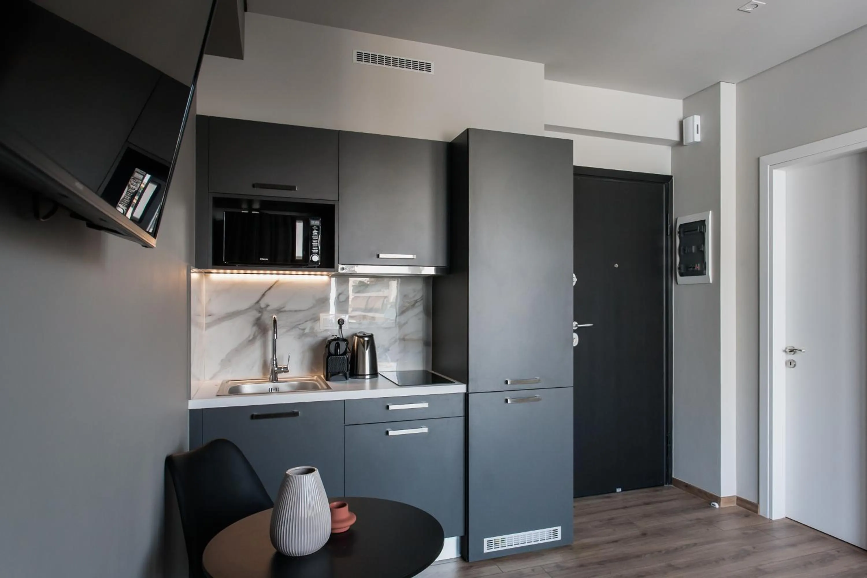 TV and multimedia in WYZ Athens Apartments by UPSTREET