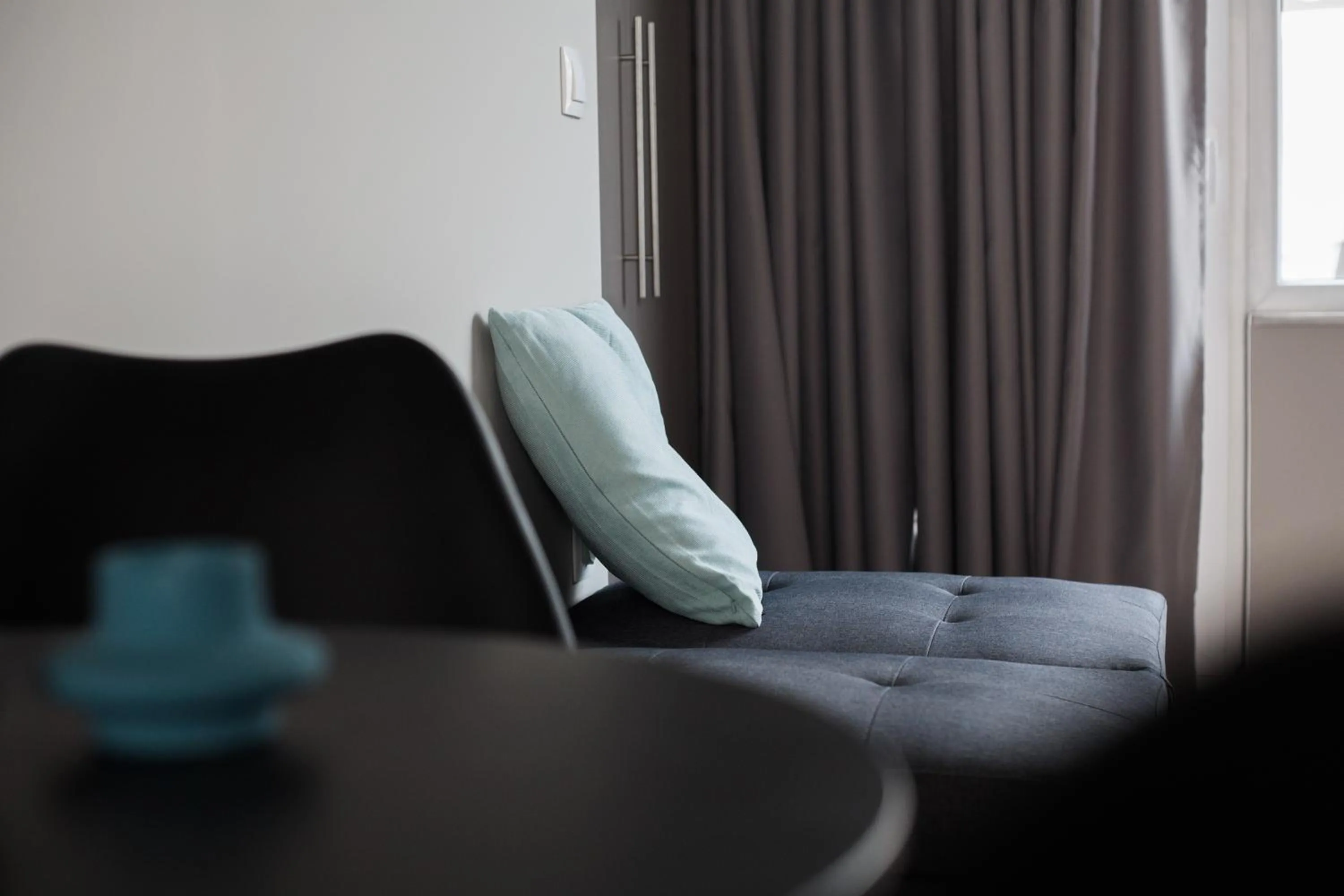 Seating area in WYZ Athens Apartments by UPSTREET