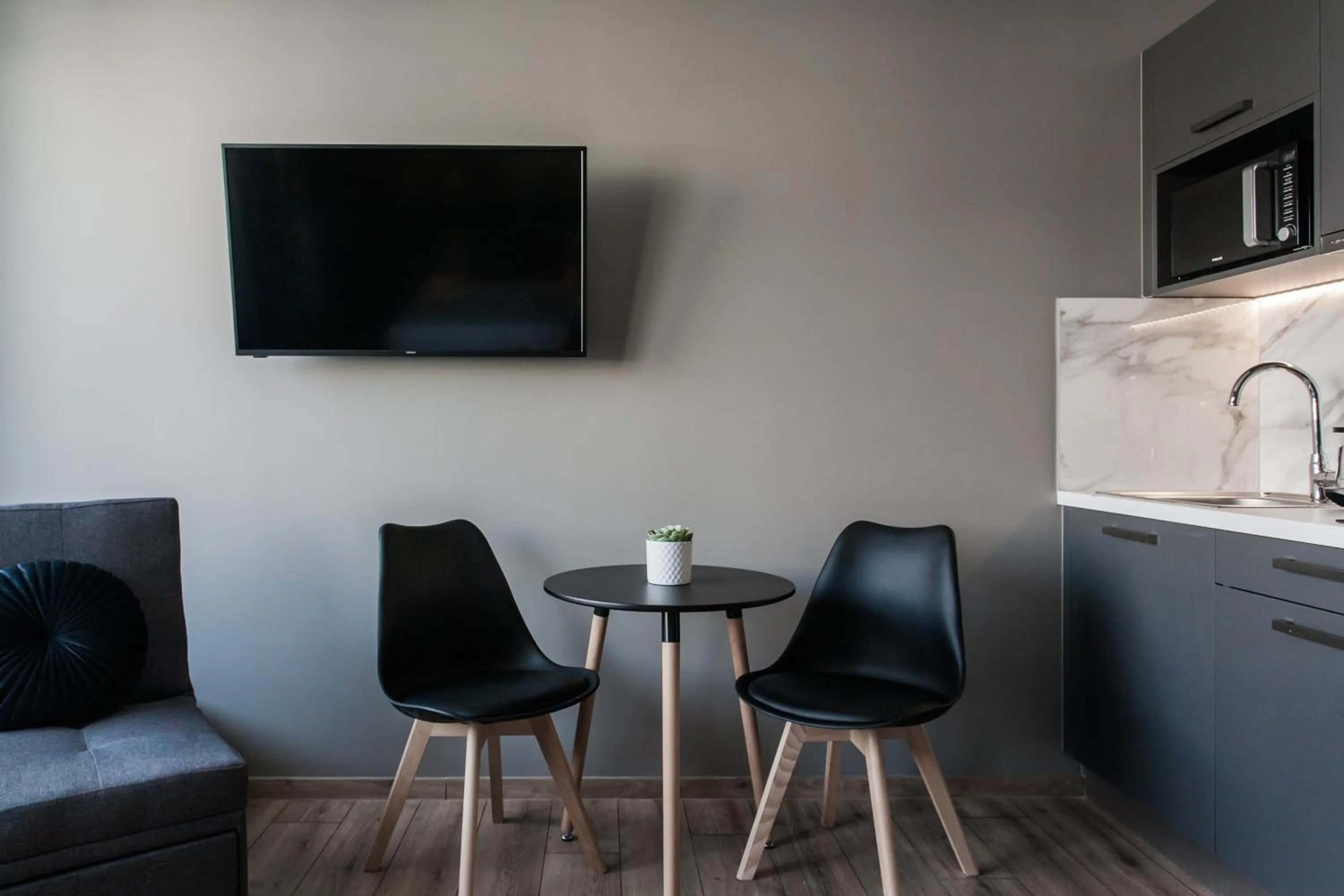 TV and multimedia in WYZ Athens Apartments by UPSTREET