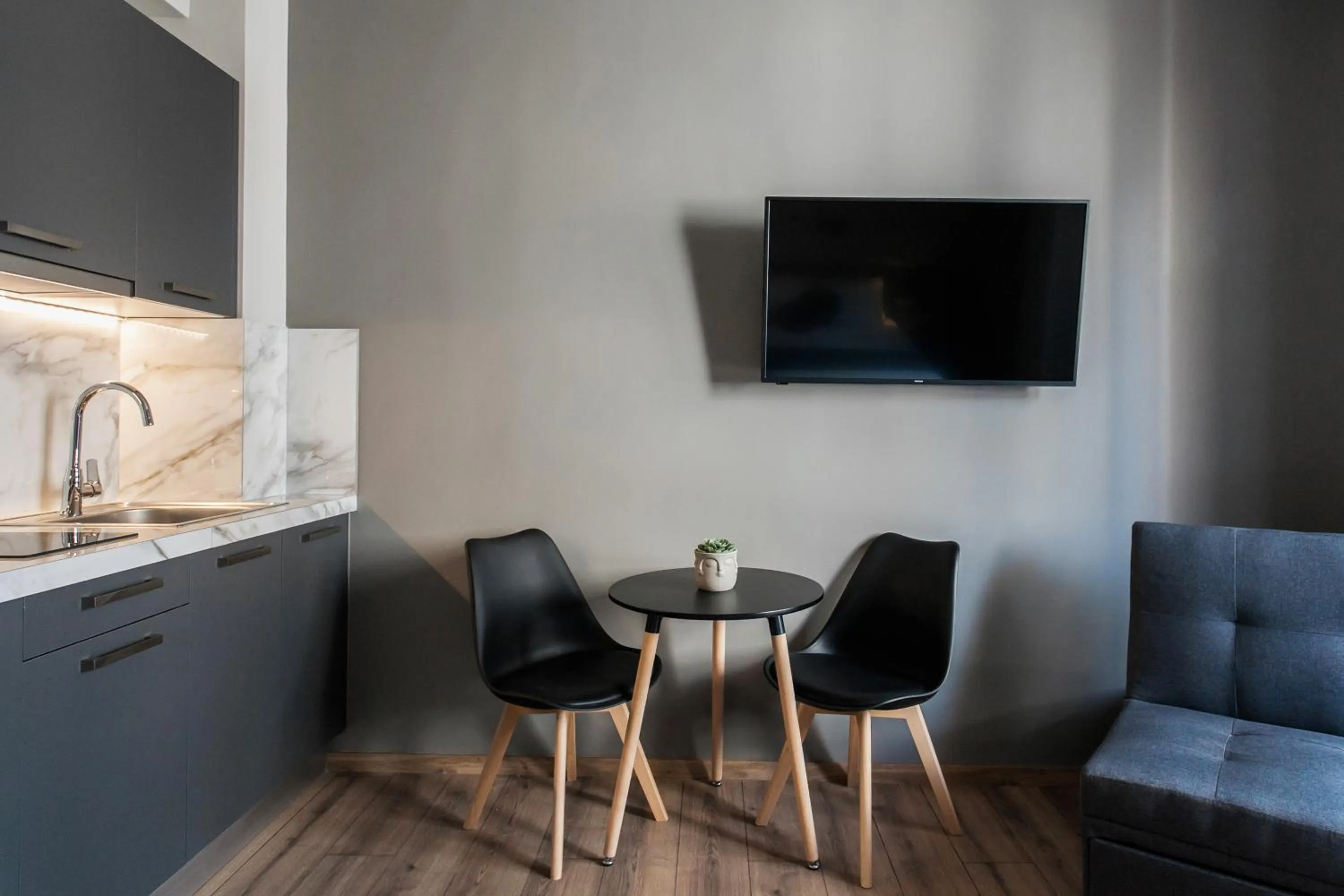 Seating area in WYZ Athens Apartments by UPSTREET