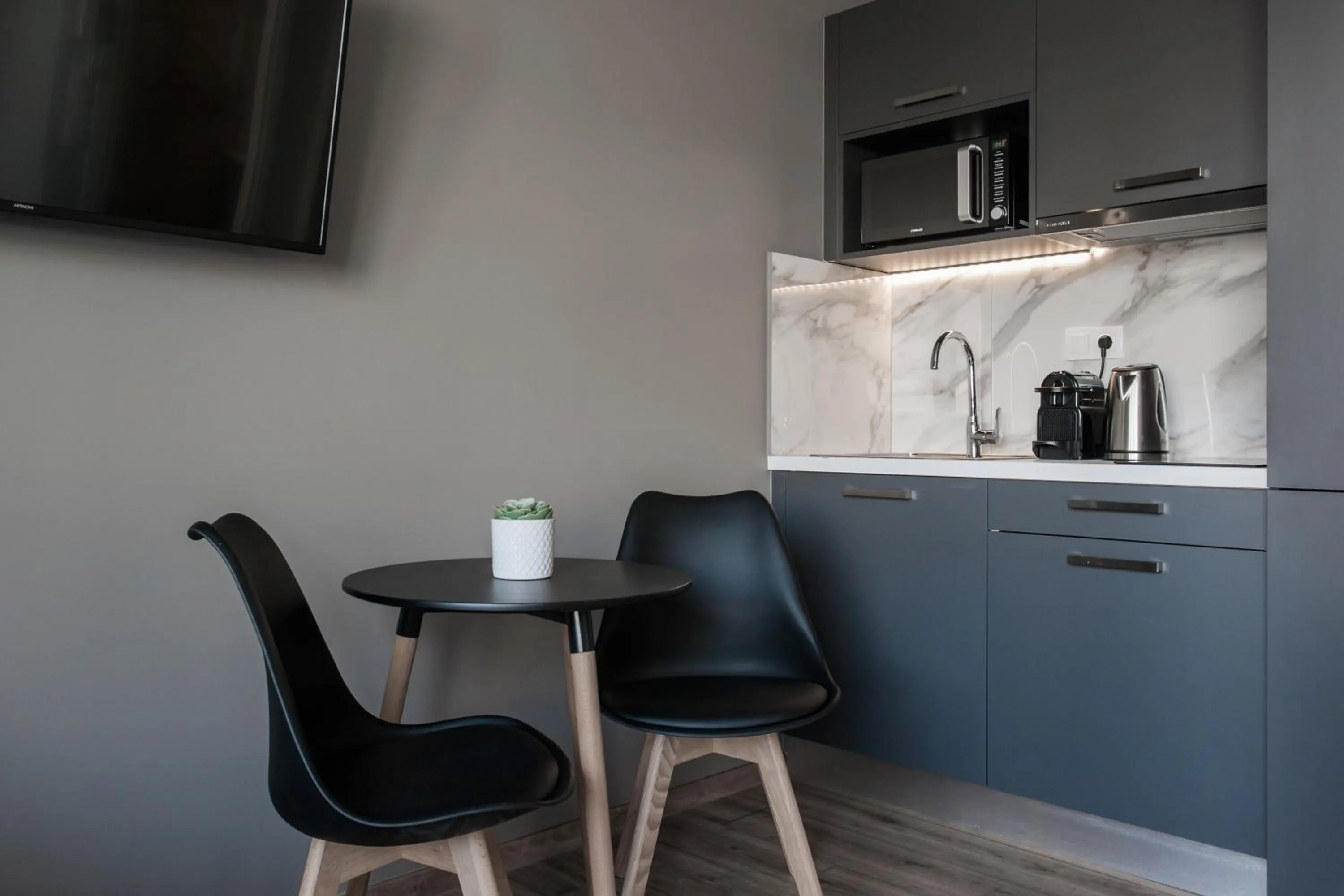 TV and multimedia in WYZ Athens Apartments by UPSTREET