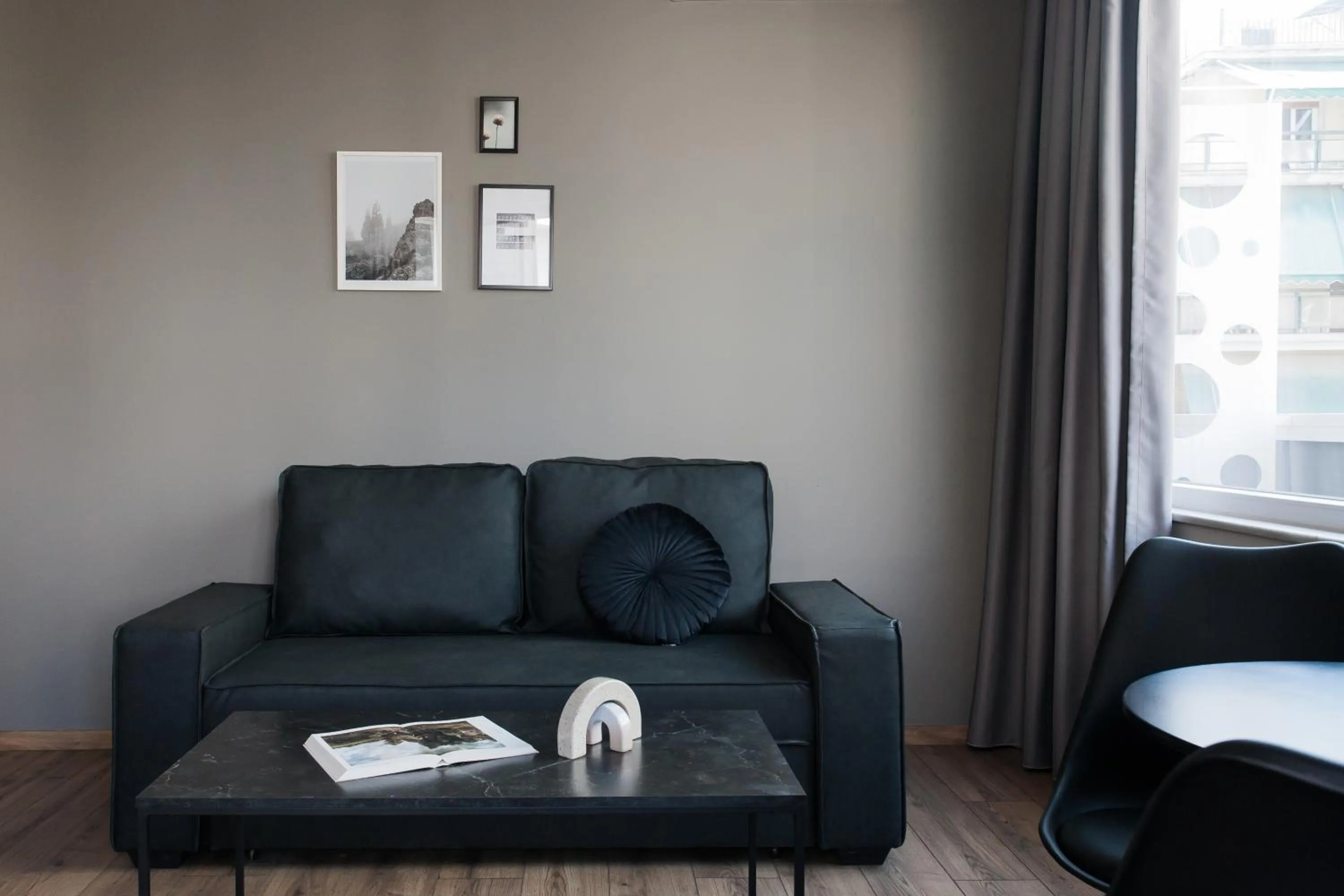 Living room in WYZ Athens Apartments by UPSTREET