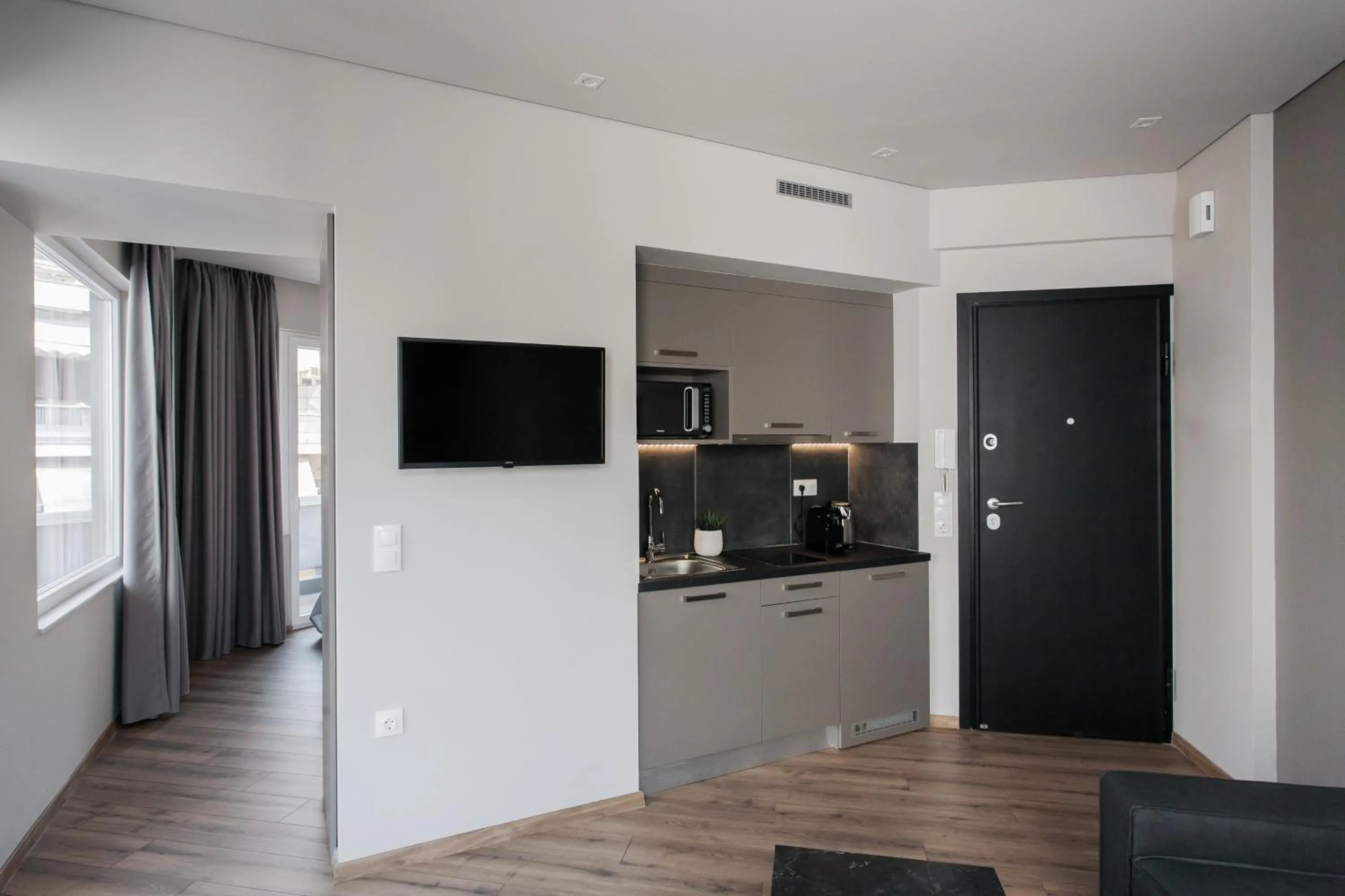 TV and multimedia in WYZ Athens Apartments by UPSTREET