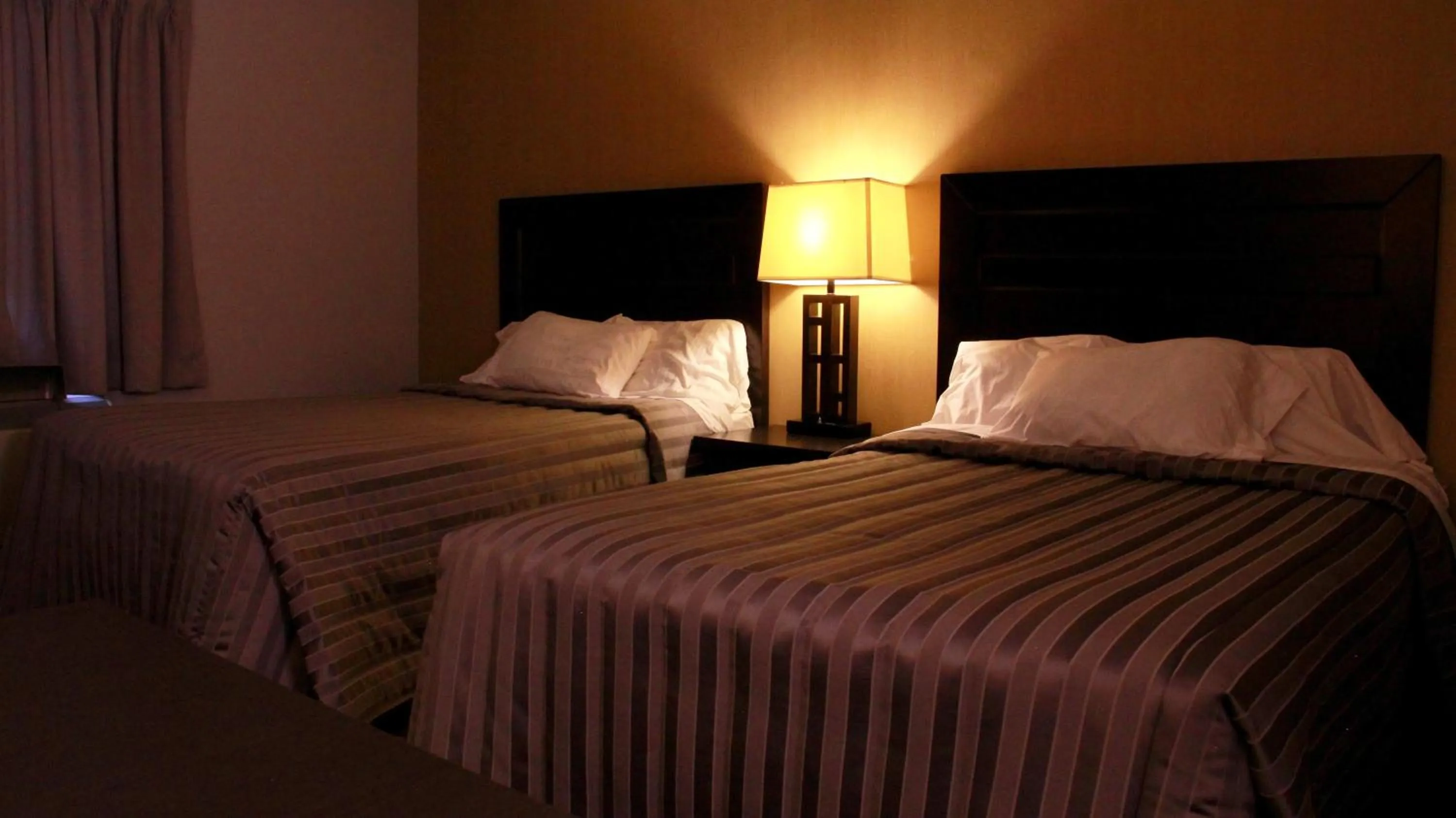 Bed in Victoria Motor Inn