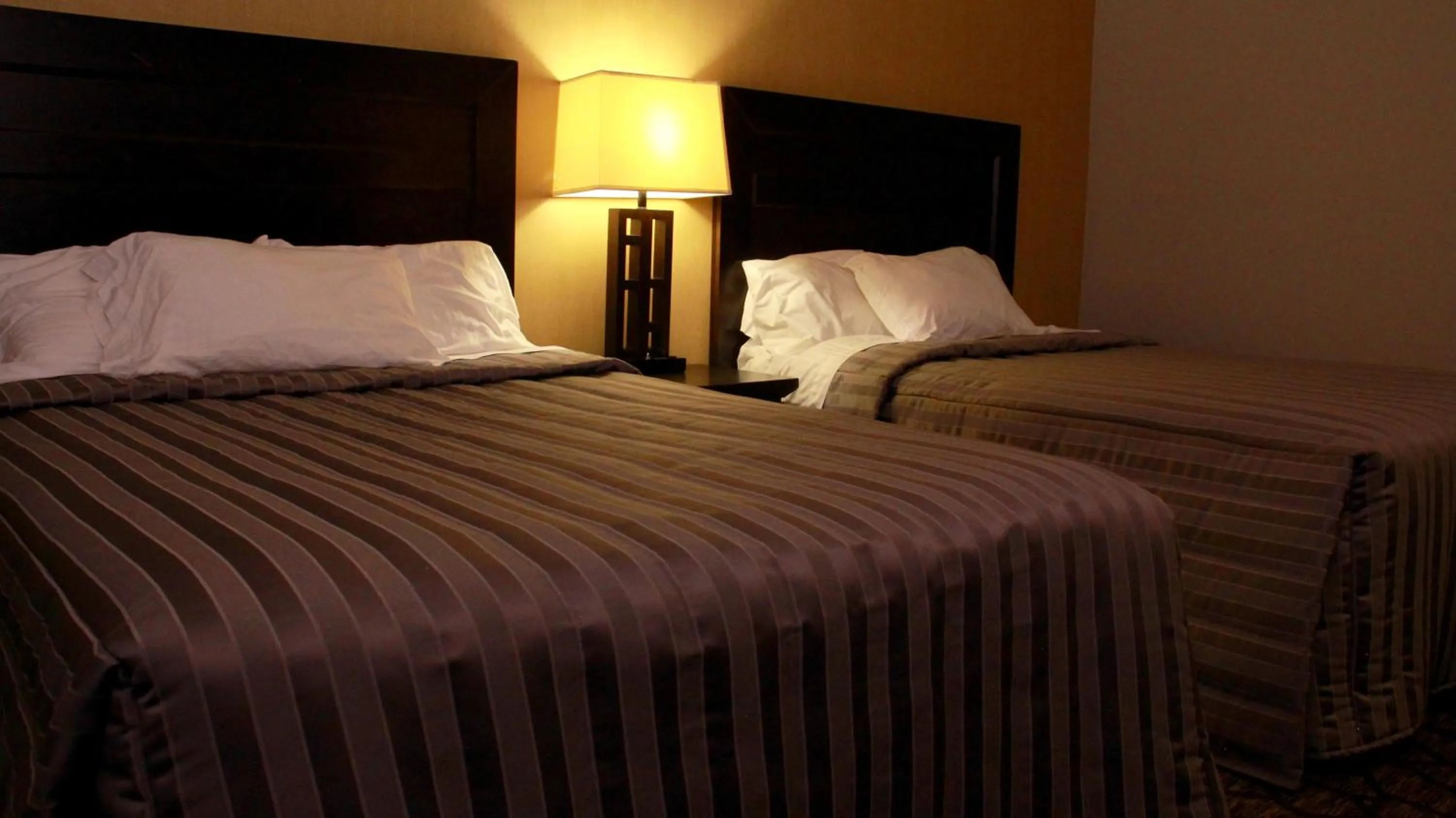 Bed in Victoria Motor Inn