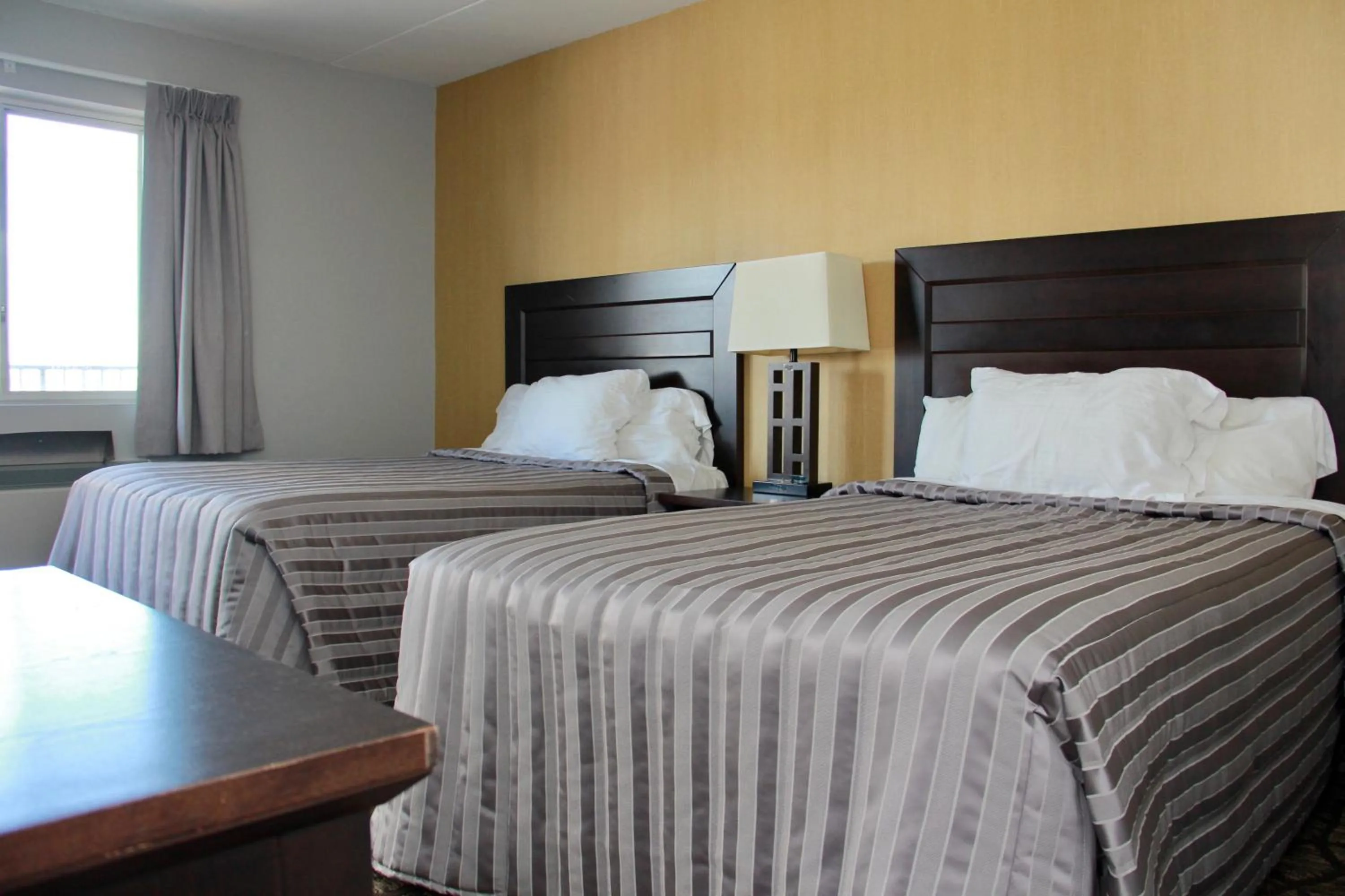 Bed in Victoria Motor Inn