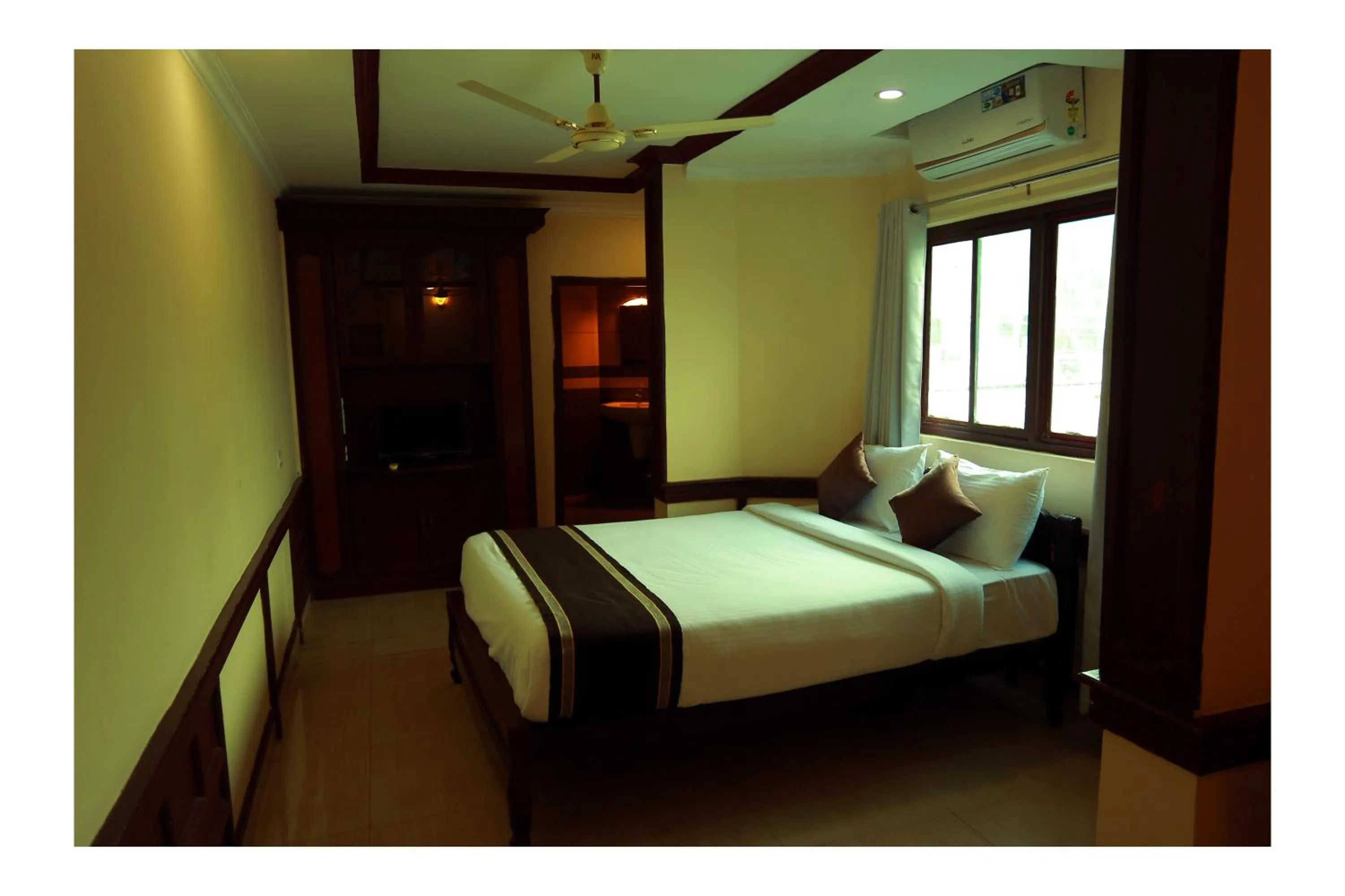 Bed in CORRIDOR CALICUT Airport Hotel