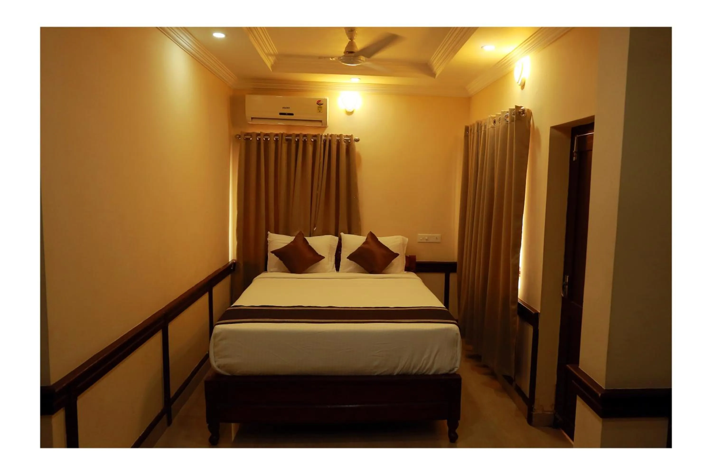 Bed in CORRIDOR CALICUT Airport Hotel