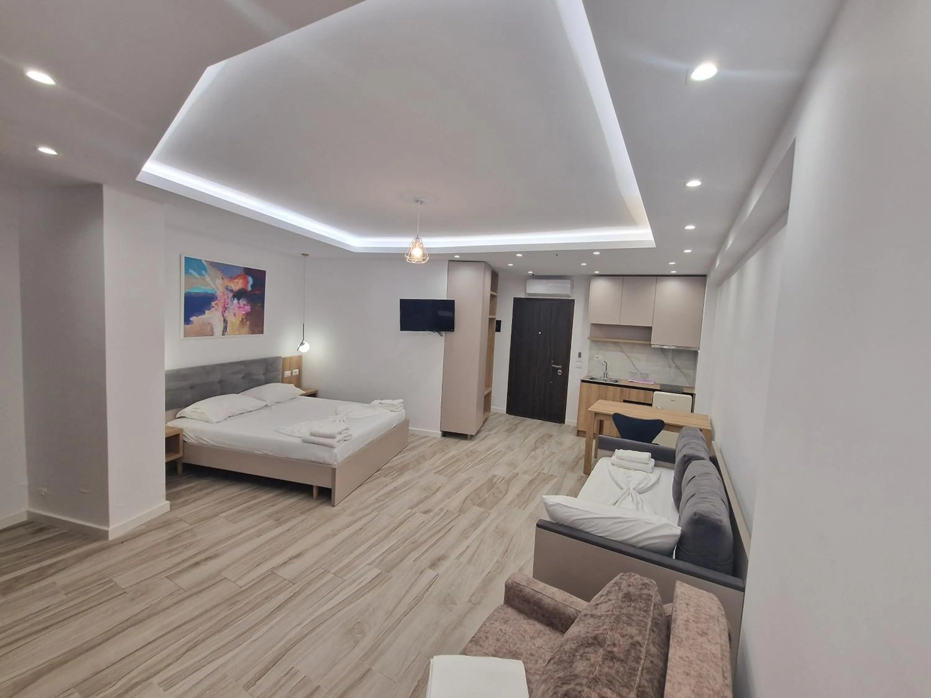 Seating area, Bed in Joanna Suites