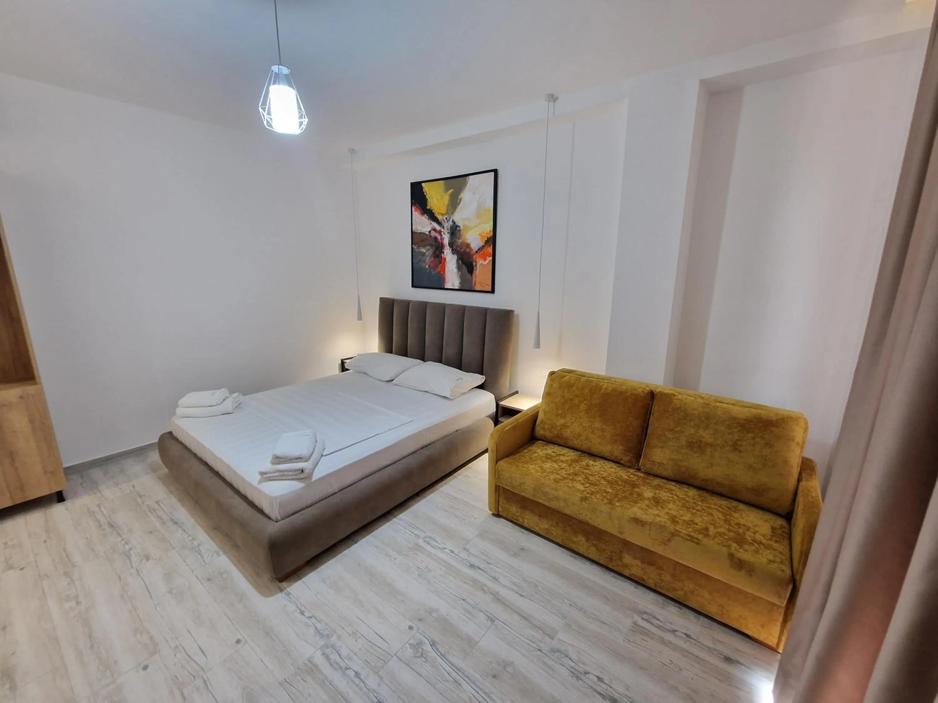 Living room, Bed in Joanna Suites