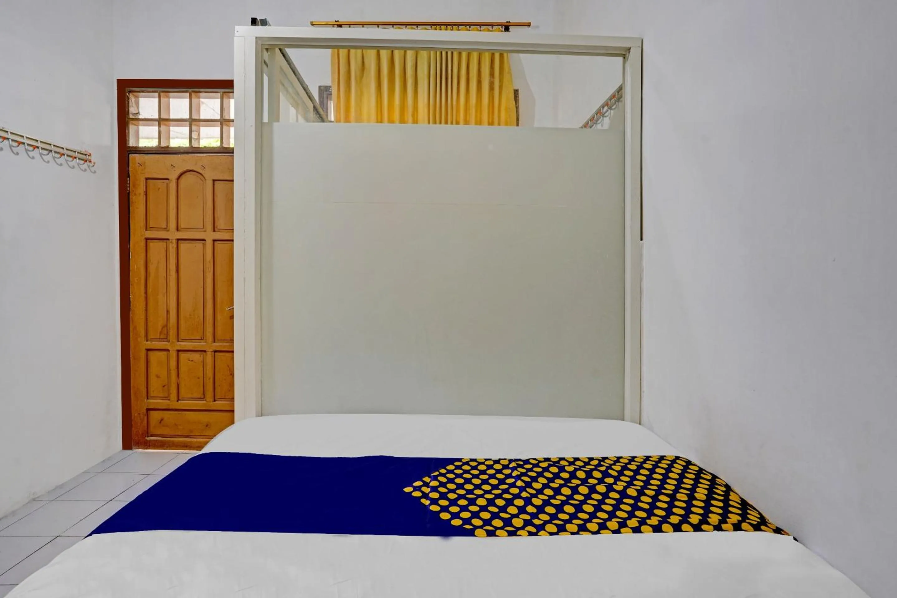 Bedroom in SPOT ON 90586 Hagawa Syariah Homestay