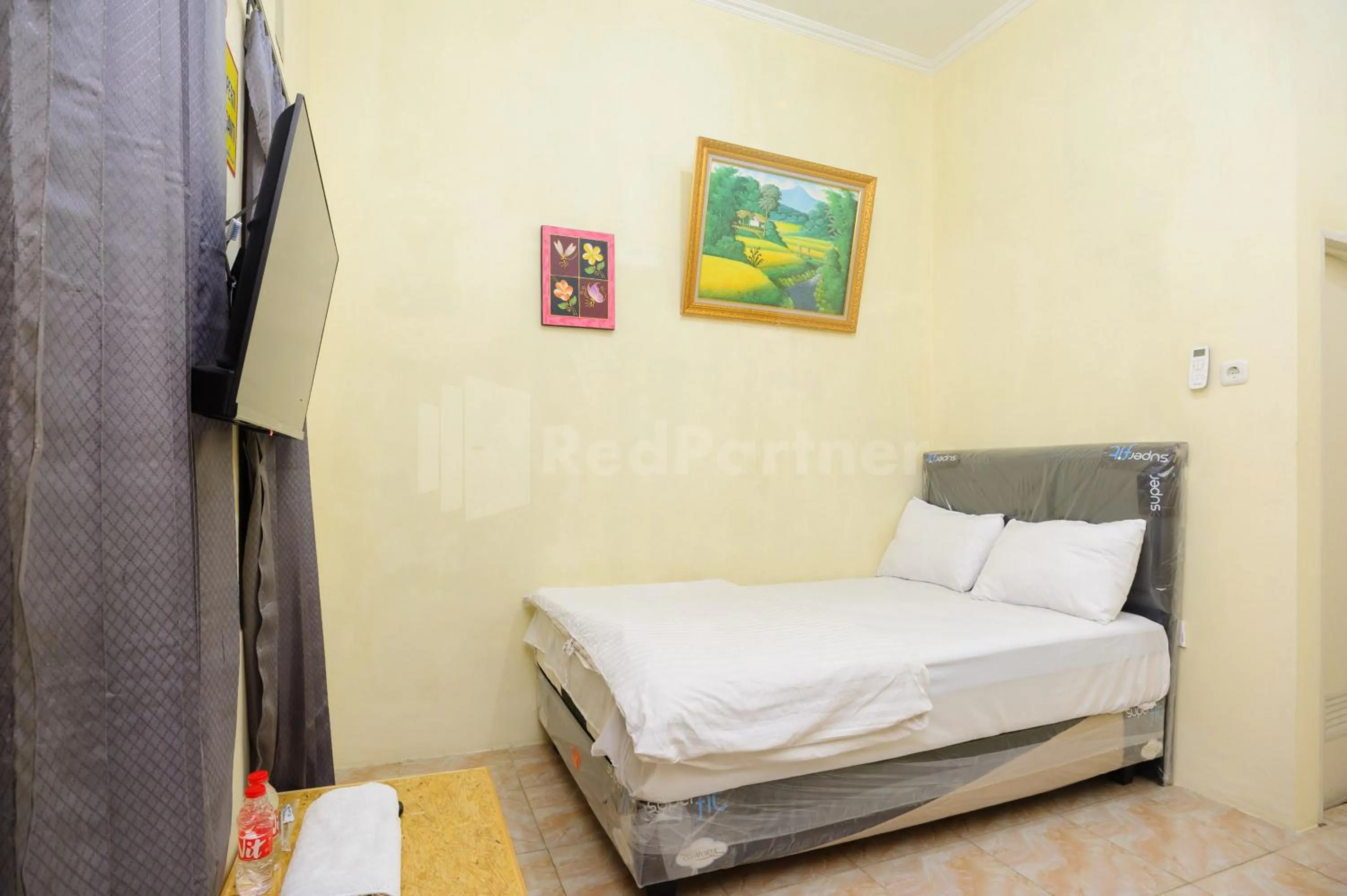 Bed in OYO 90594 Fajar Inn