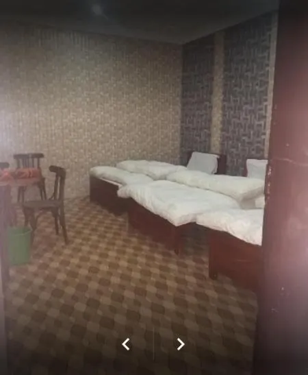 Bed in Happy Heart Hotel & Restaurant