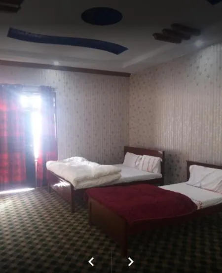 Bed in Happy Heart Hotel & Restaurant