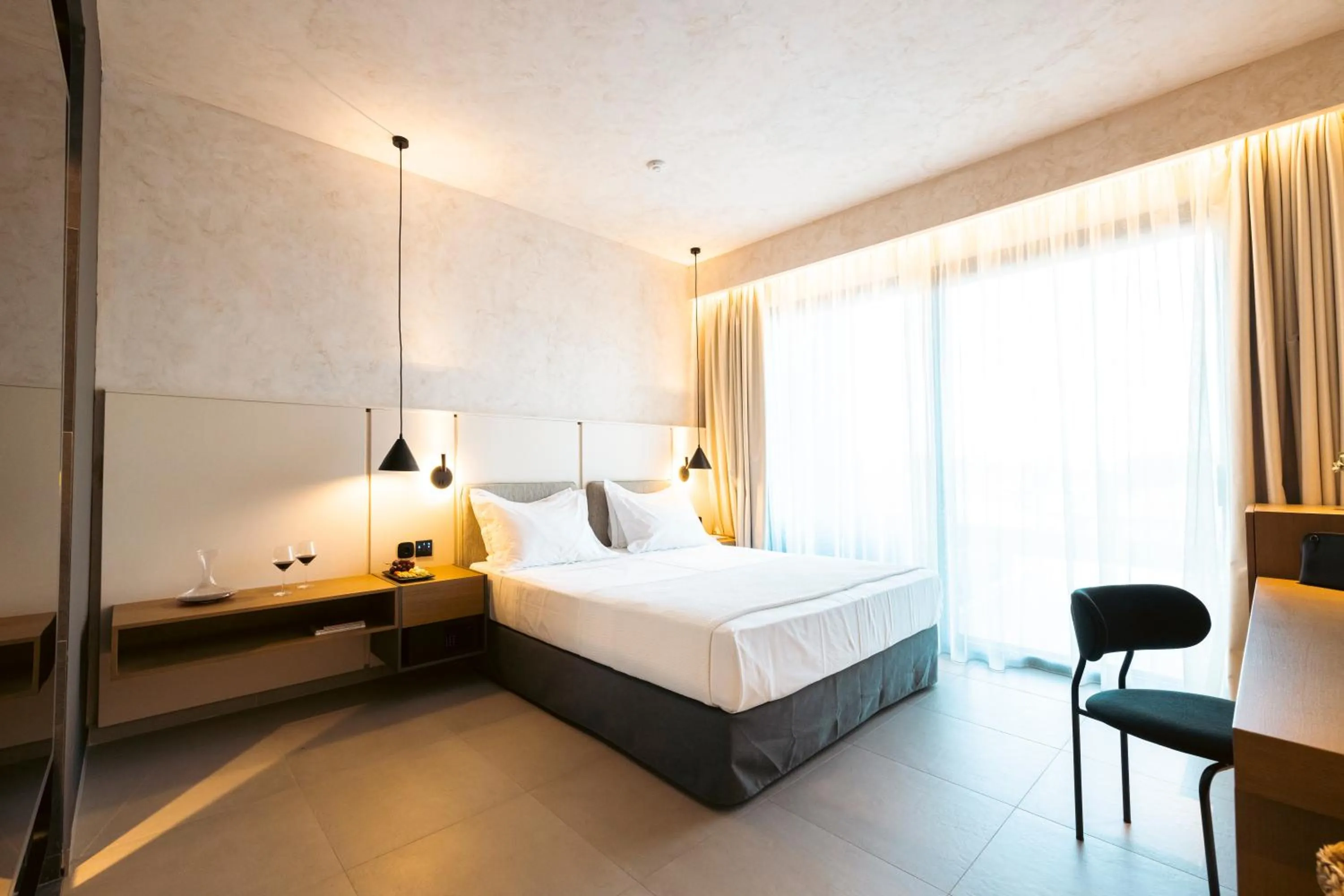 Bed in Anasa Luxury Resort