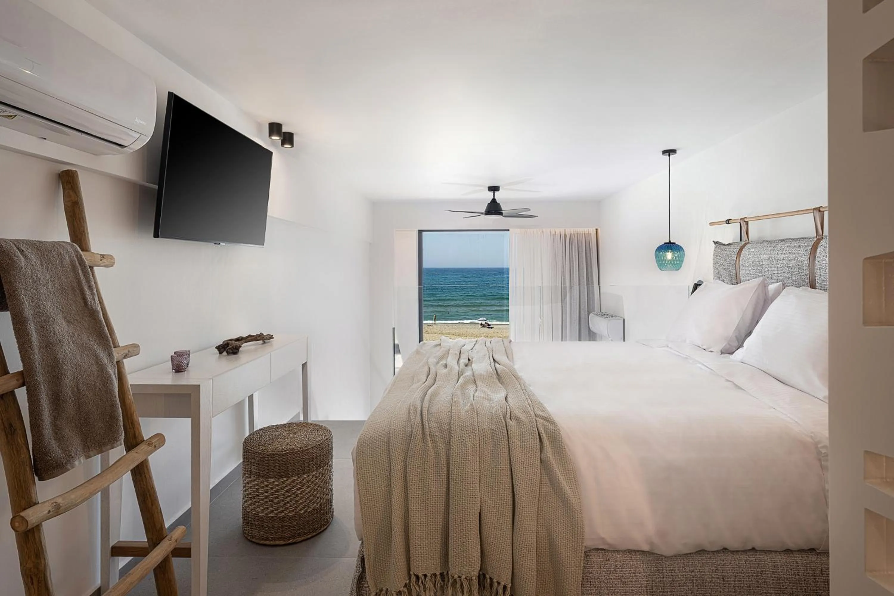 Bed in Calla Luxury Seafront Suites