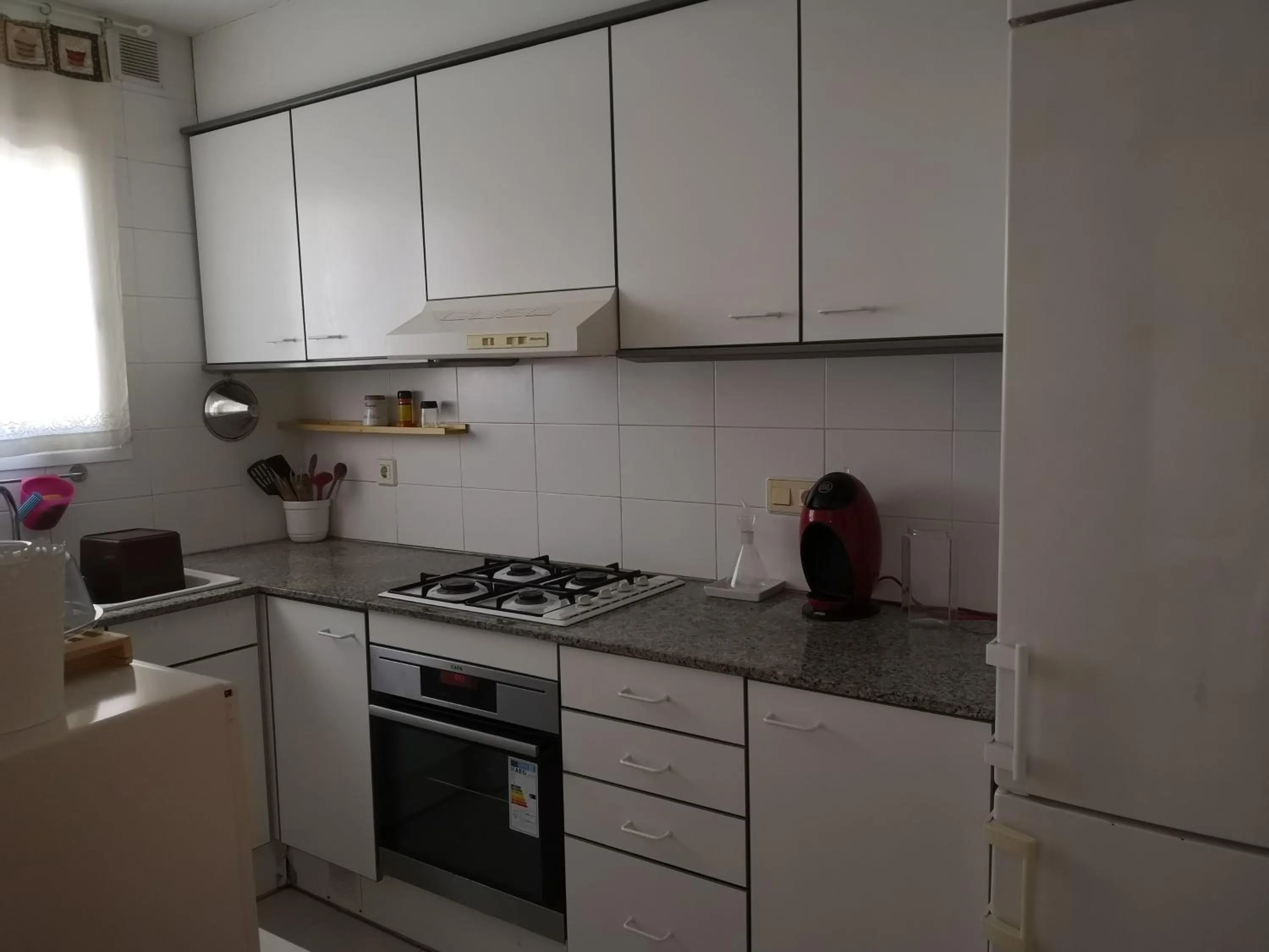 Kitchen or kitchenette in LLOGUER30 Apartamento Lotus, piscina y parquing